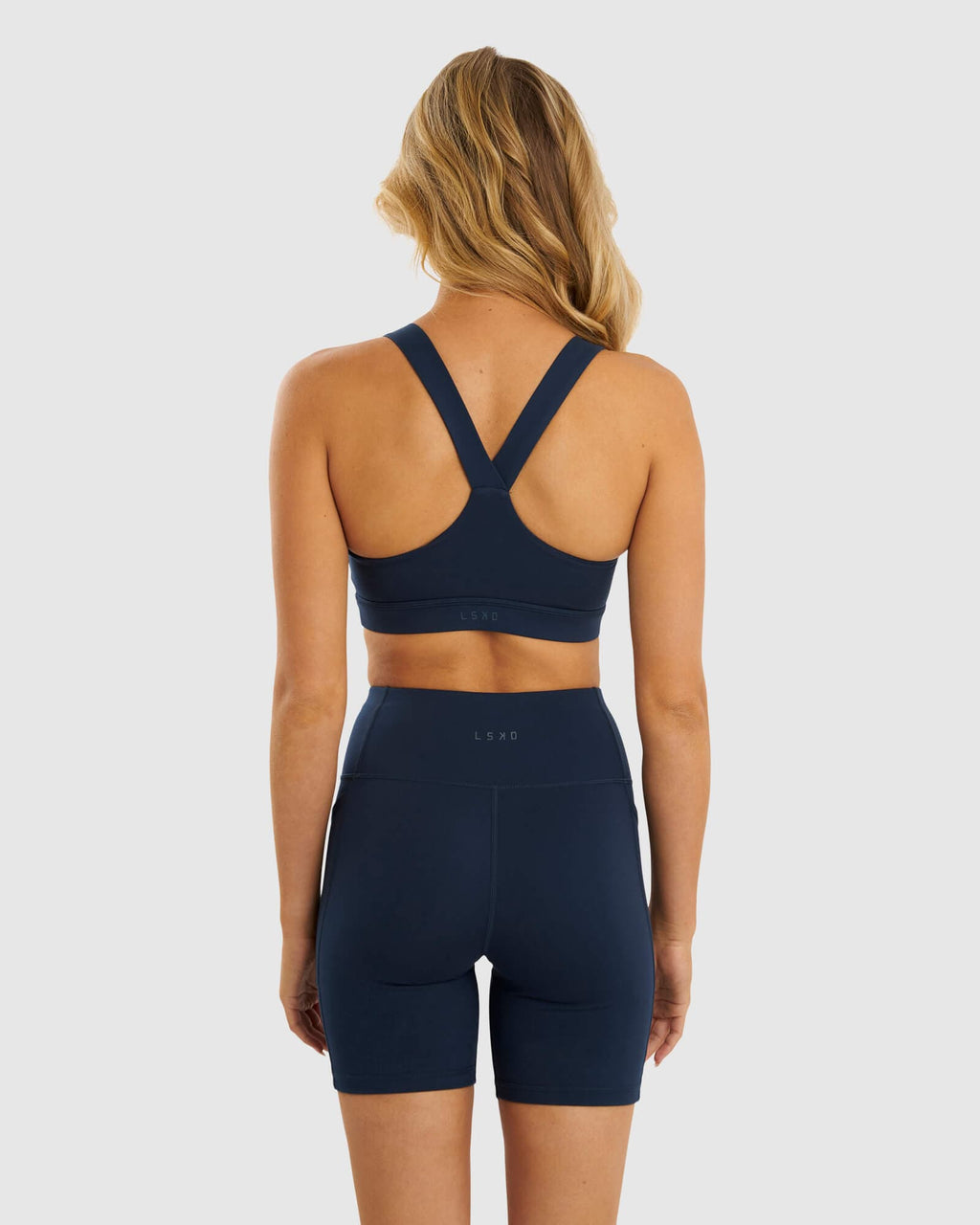 Model wearing Rep Sports Bra Small Logo - Carbon