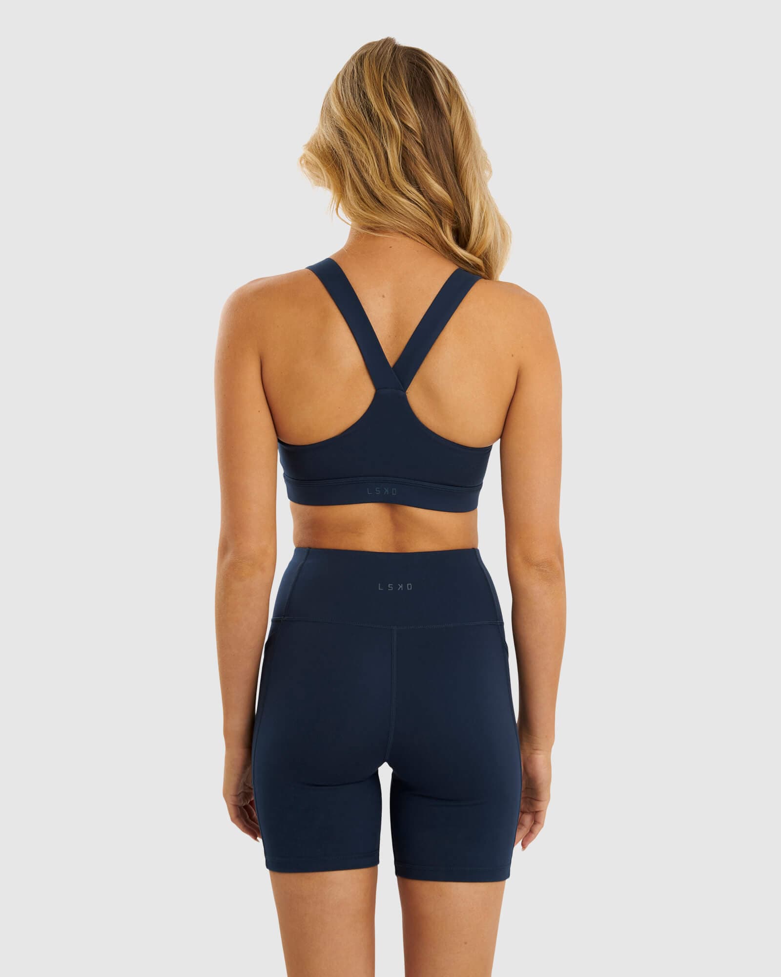 Model wearing Rep Sports Bra Small Logo - Carbon