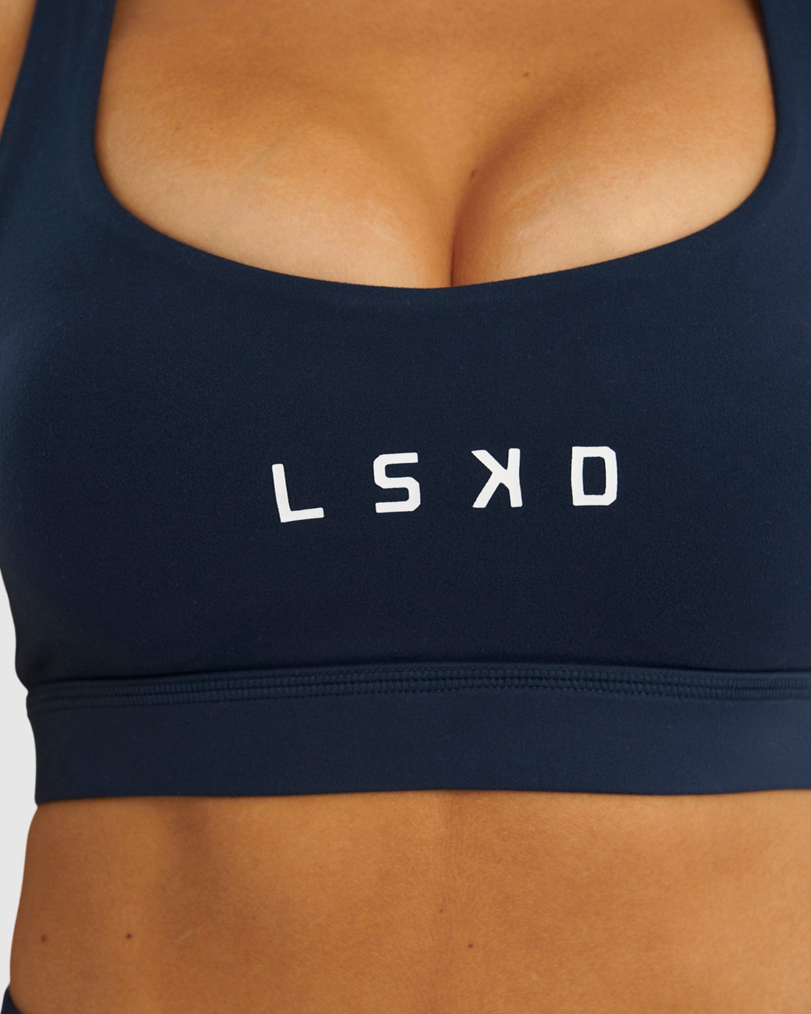 Model wearing Rep Sports Bra Small Logo - Carbon
