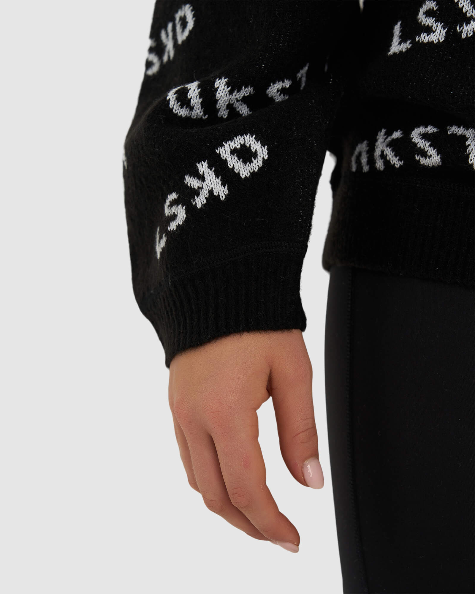 Model wearing Duplicate Knit Sweater - Black