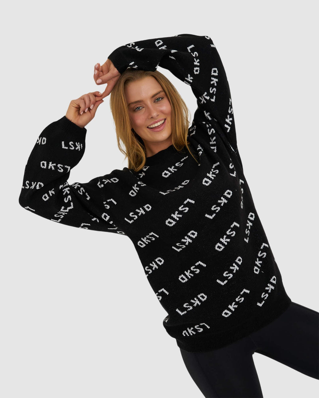 Model wearing Duplicate Knit Sweater - Black
