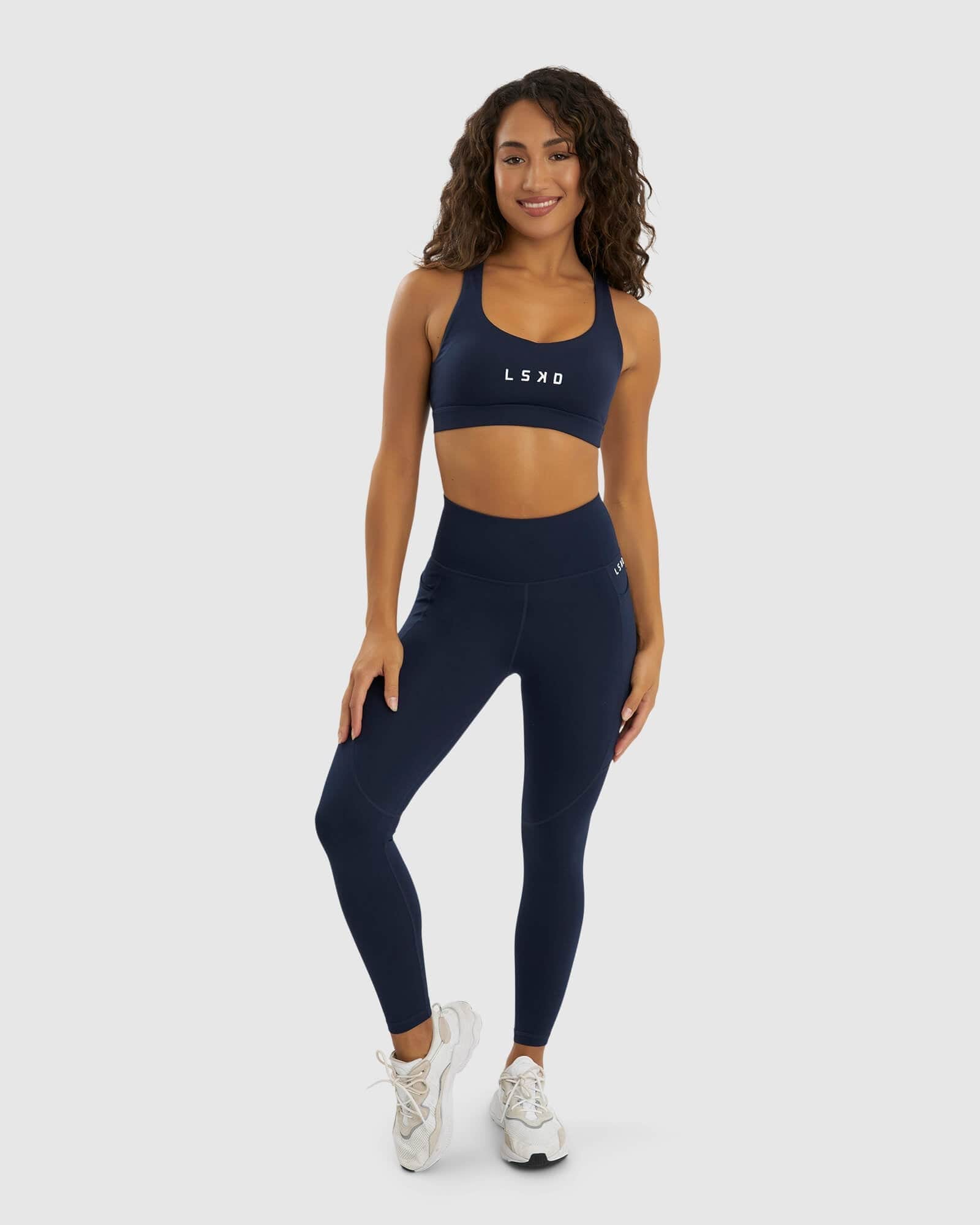 Model wearing Rep Sports Bra Small Logo - Navy