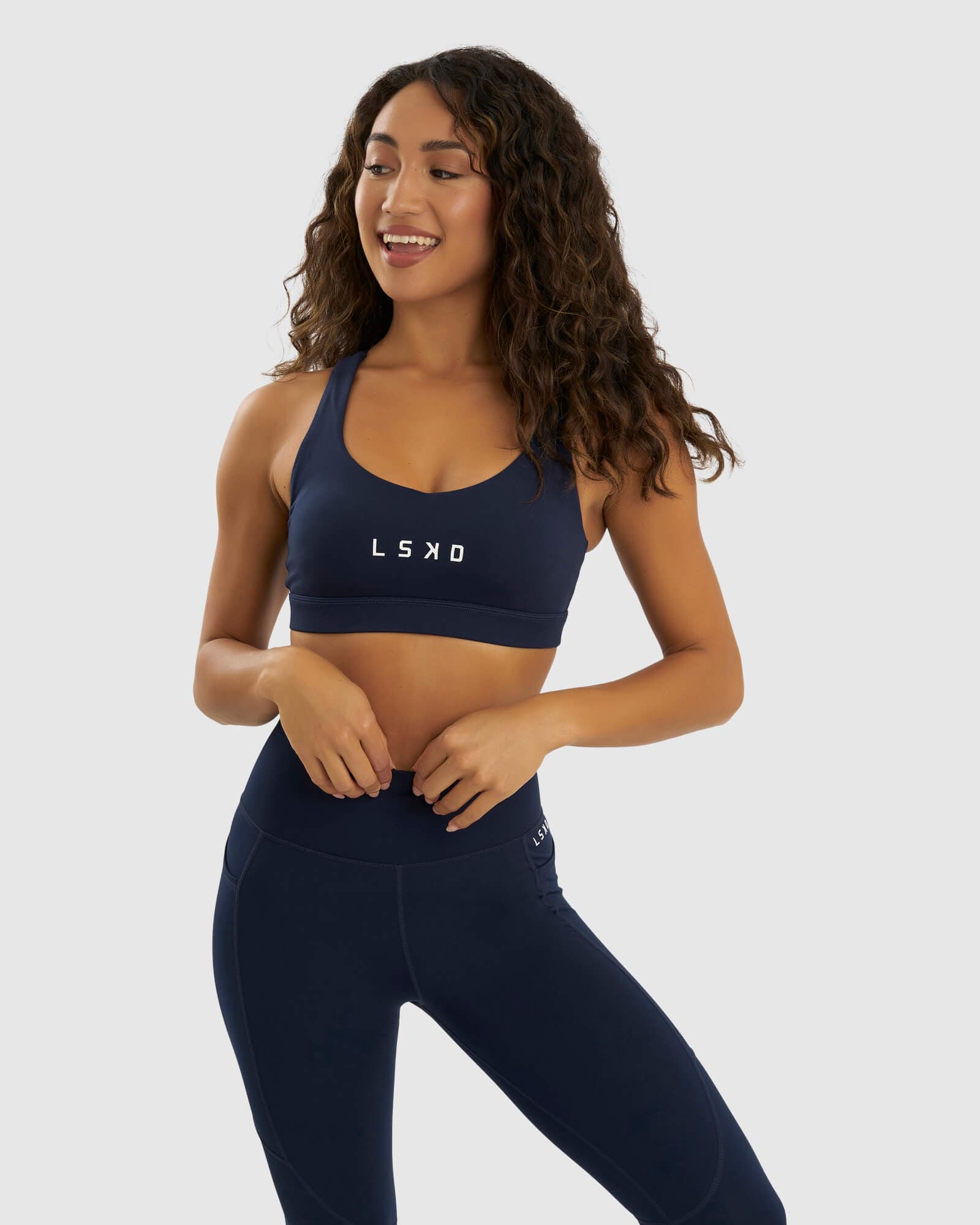 Model wearing Rep Sports Bra Small Logo - Navy