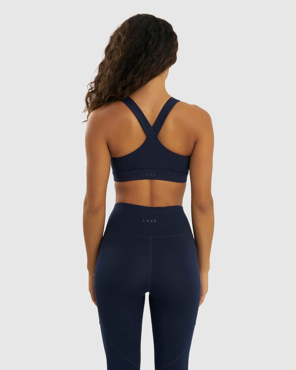 Model wearing Rep Sports Bra Small Logo - Navy