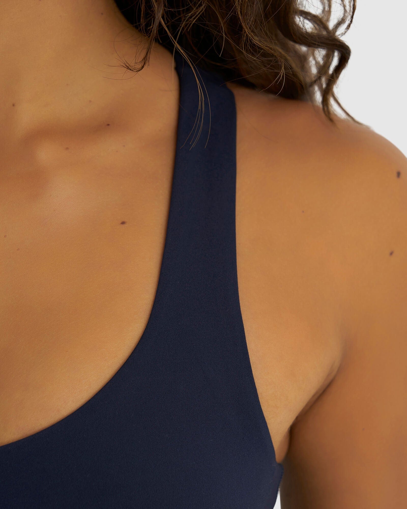 Model wearing Rep Sports Bra Small Logo - Navy