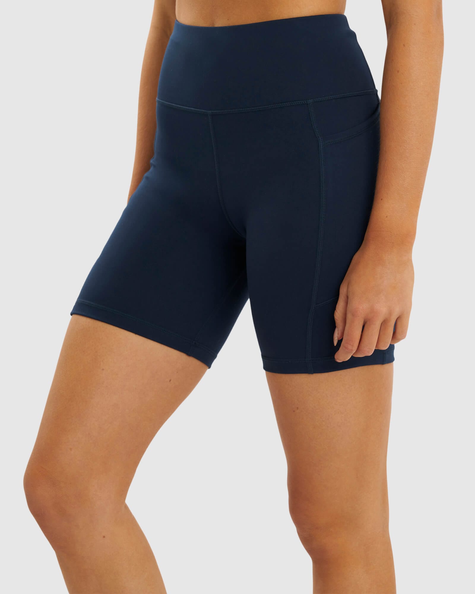 Model wearing Rep Mid Short Tight Small Logo - Carbon