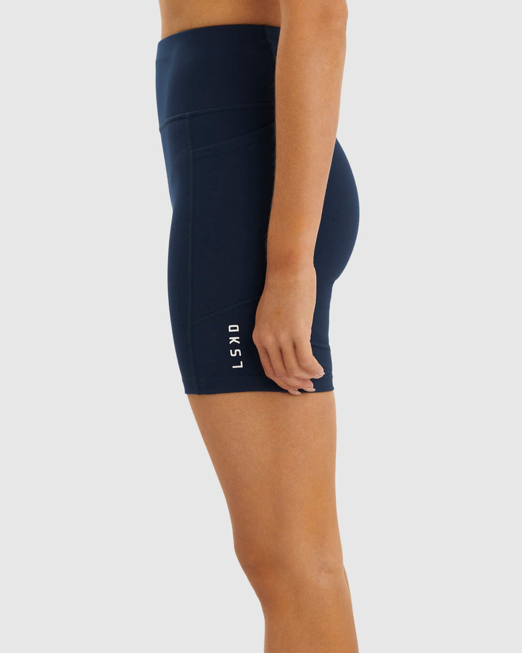 Model wearing Rep Mid Short Tight Small Logo - Carbon