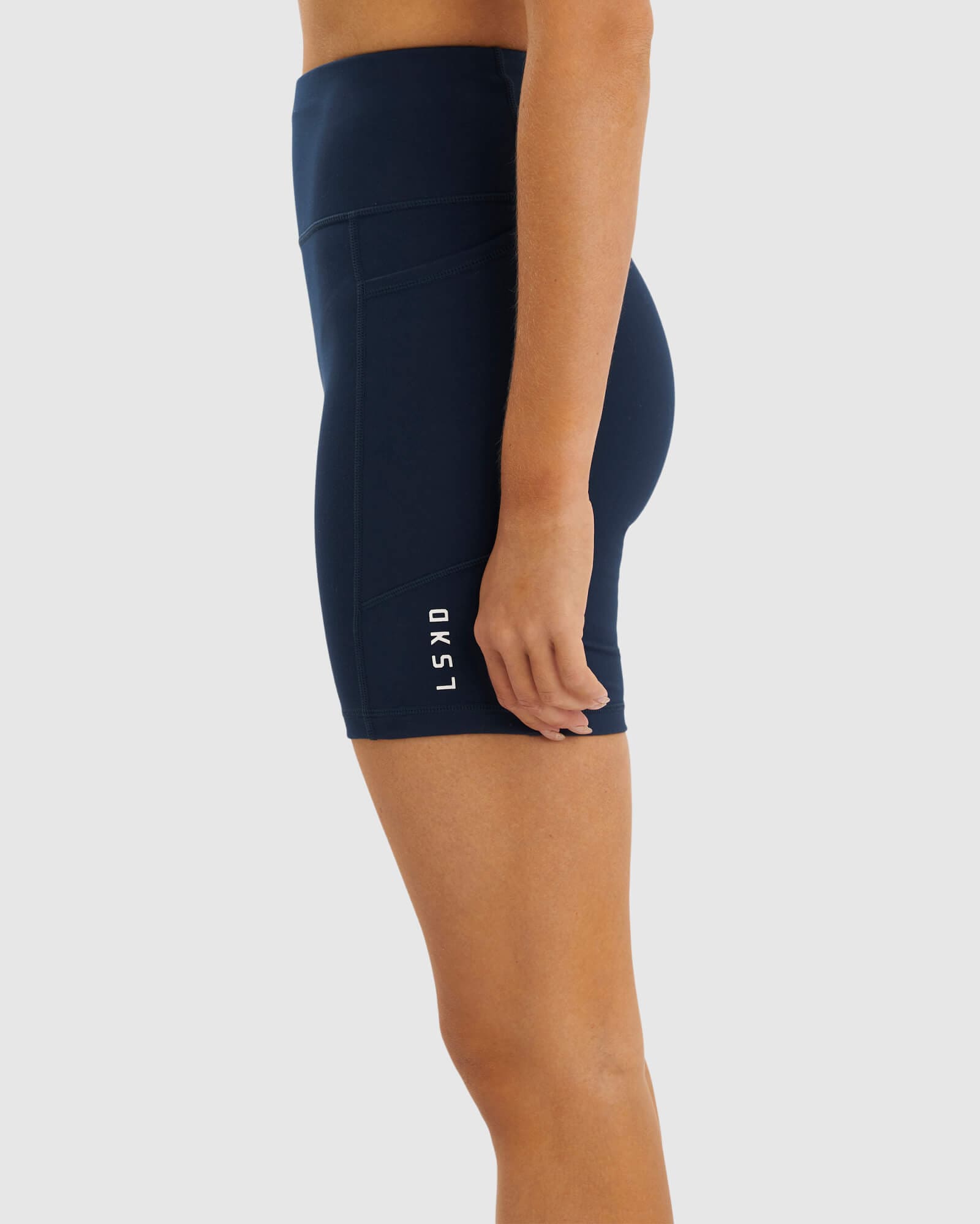 Model wearing Rep Mid Short Tight Small Logo - Carbon