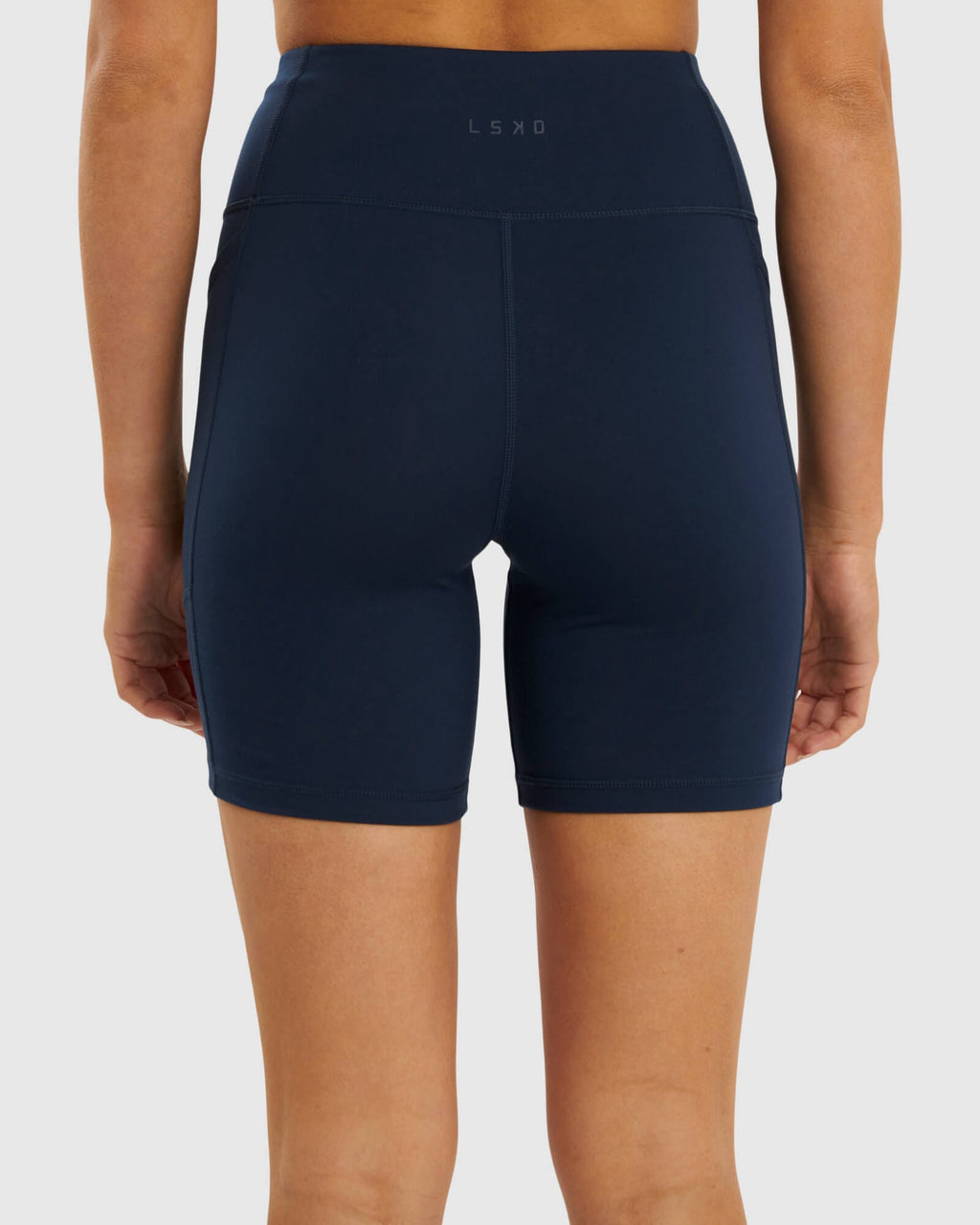 Model wearing Rep Mid Short Tight Small Logo - Carbon