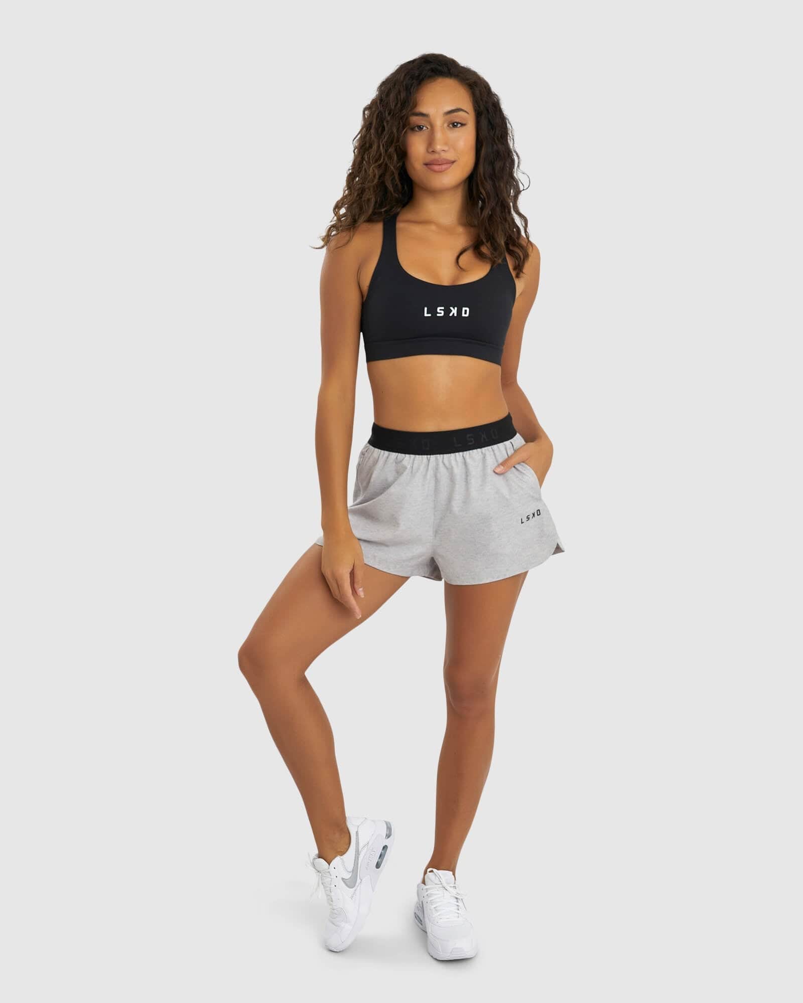 Model wearing Competition Performance Short - Light Grey Marl