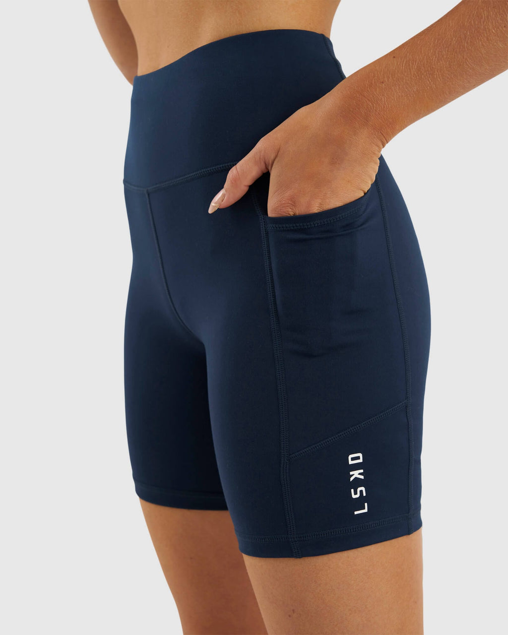 Model wearing Rep Mid Short Tight Small Logo - Carbon