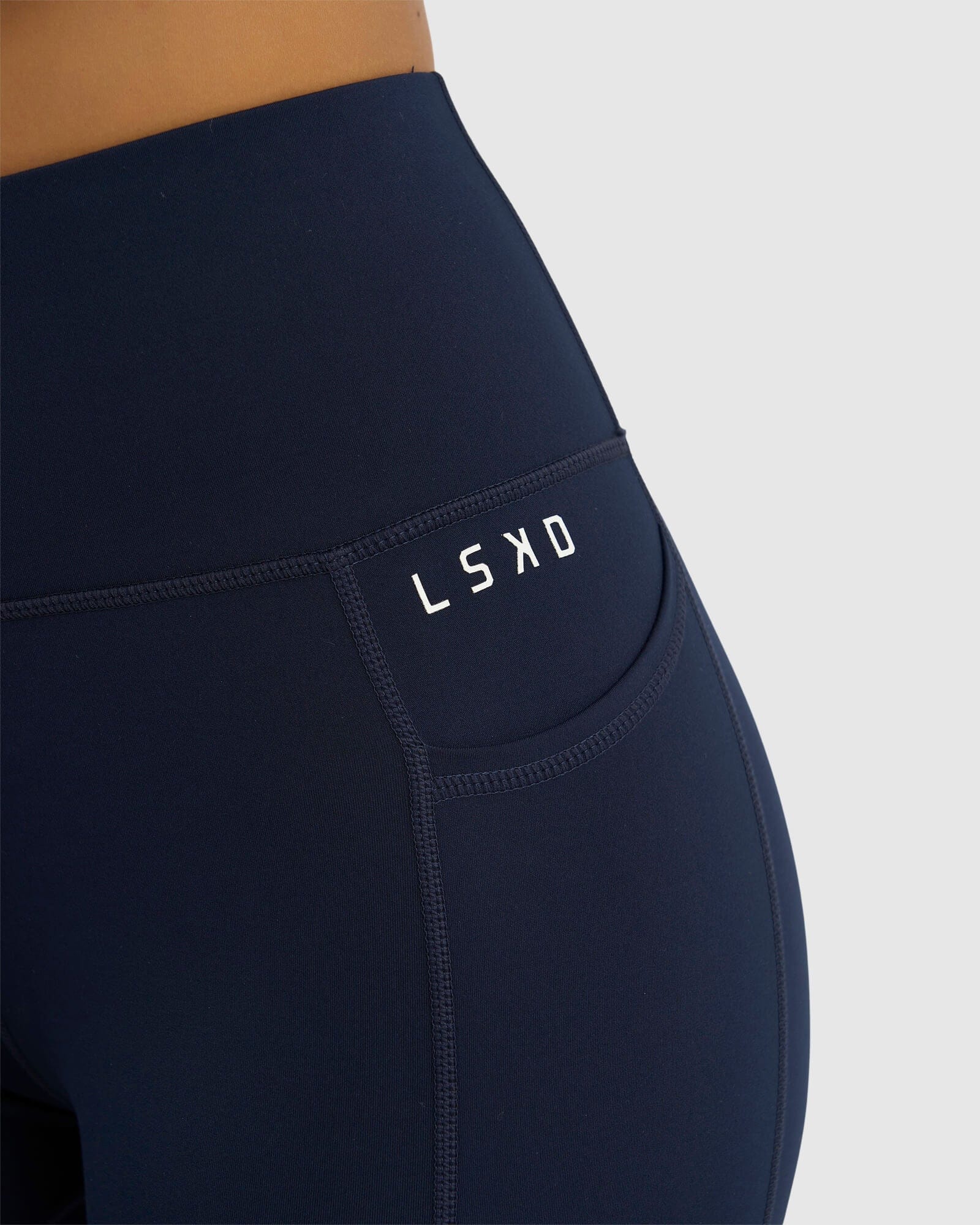 Model wearing Rep 3/4 Length Tight Small Logo - Navy