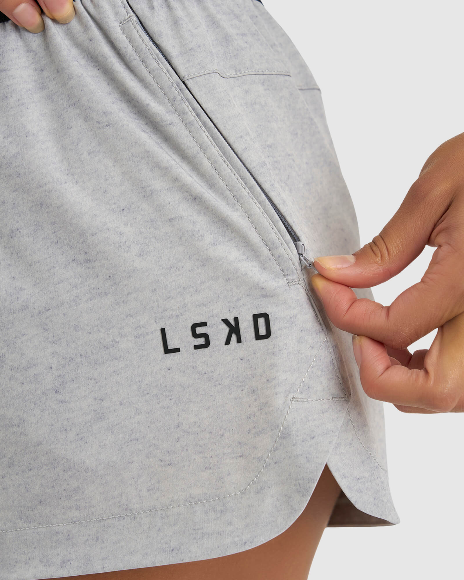 Model wearing Competition Performance Short - Light Grey Marl