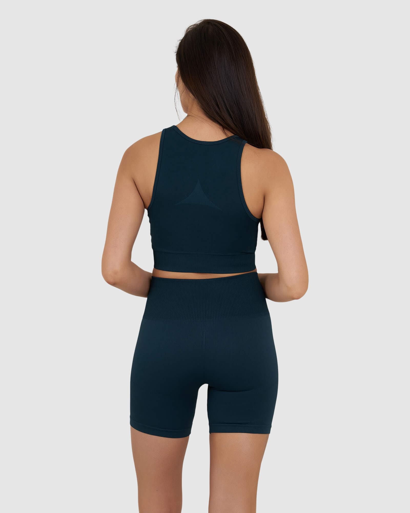 Model wearing Limitless Seamless Crop Top - Deep Teal