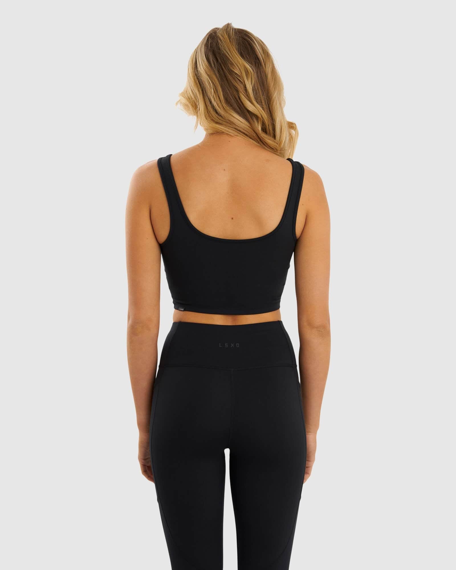 Model wearing Knockout Active Tank - Black