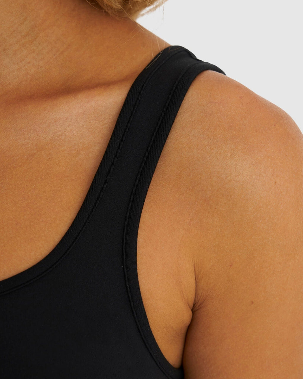 Model wearing Knockout Active Tank - Black