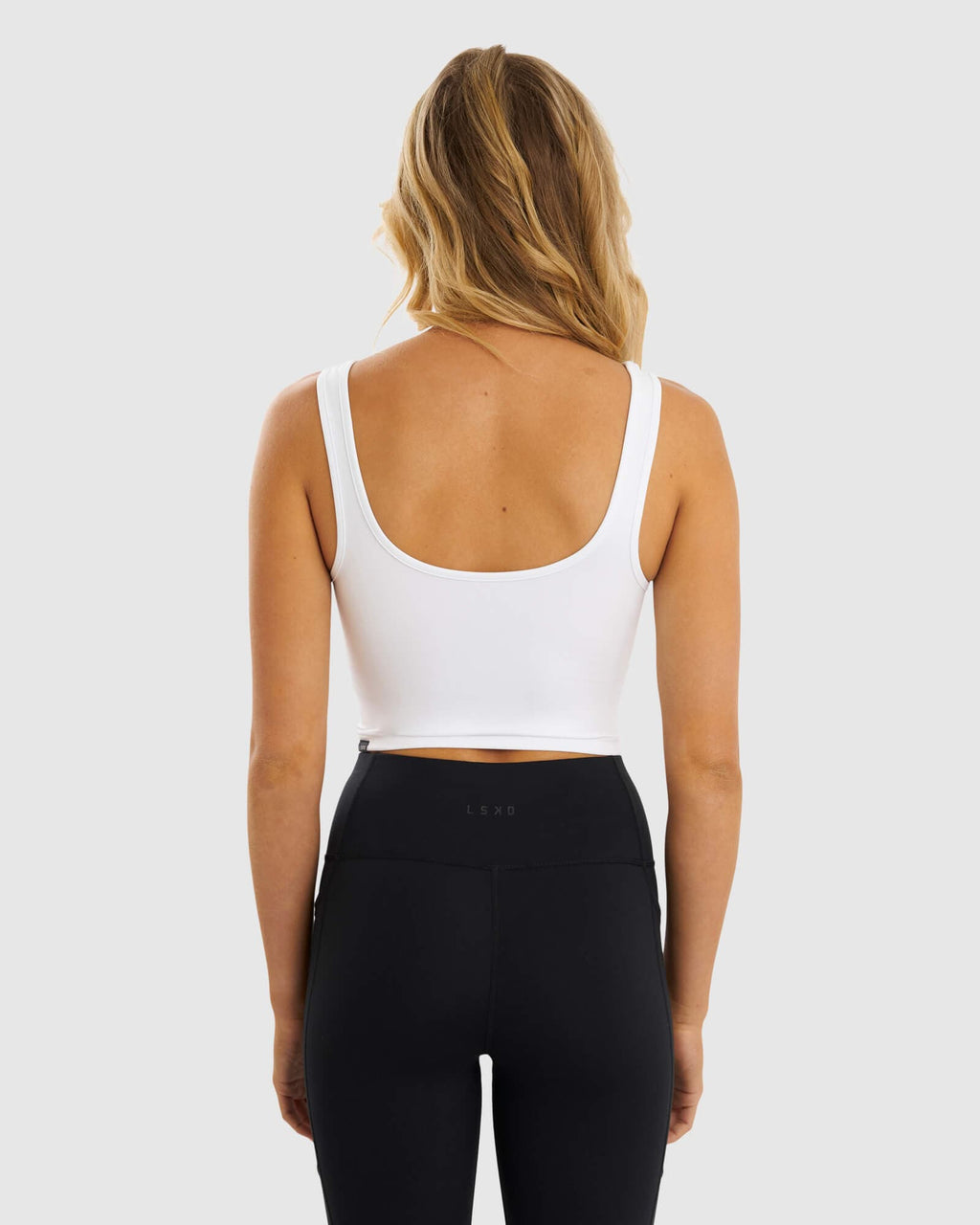 Model wearing Knockout Active Tank - White