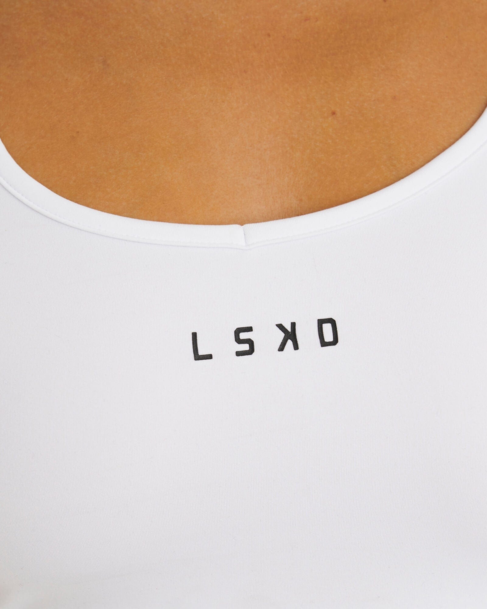 Model wearing Knockout Active Tank - White