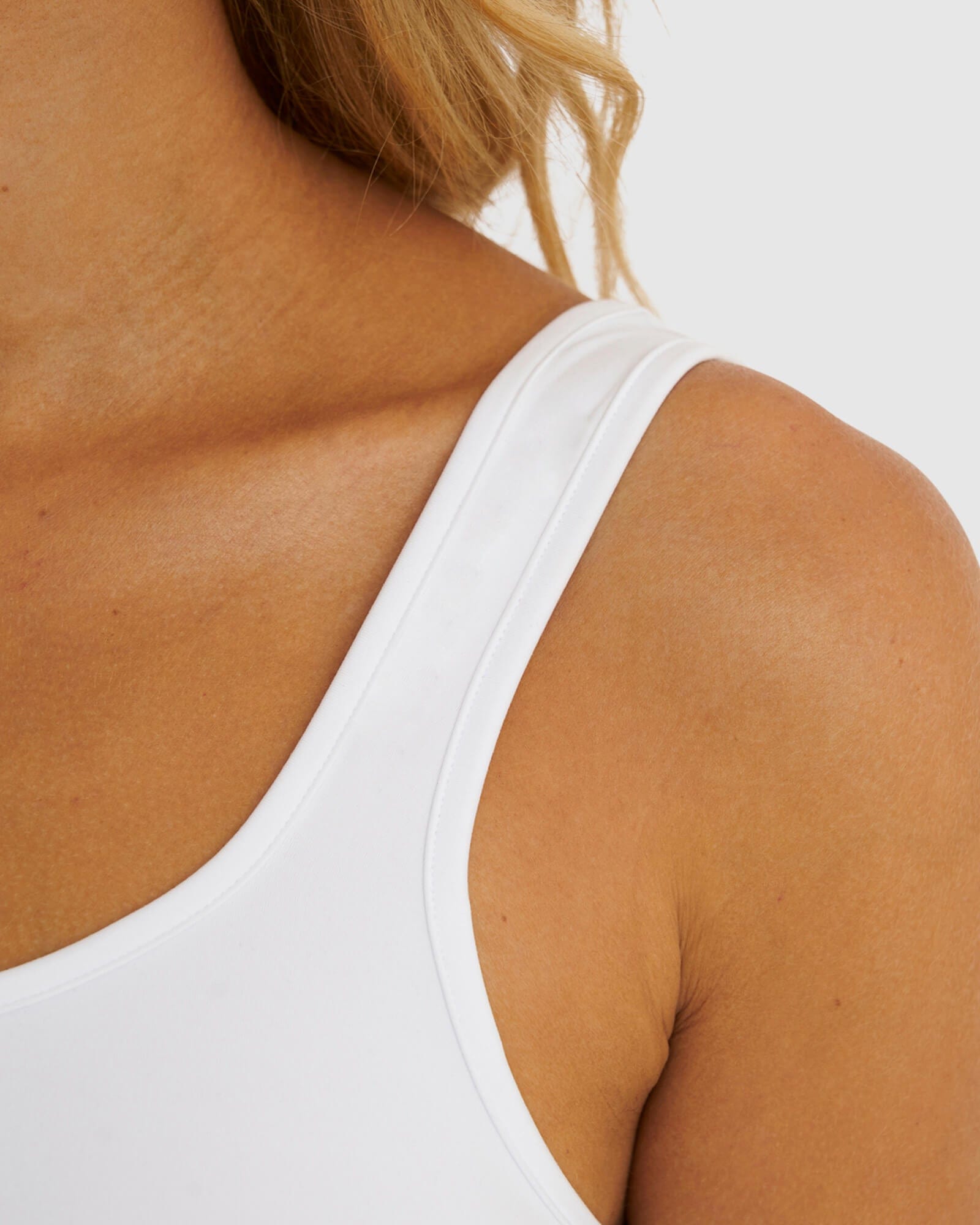 Model wearing Knockout Active Tank - White