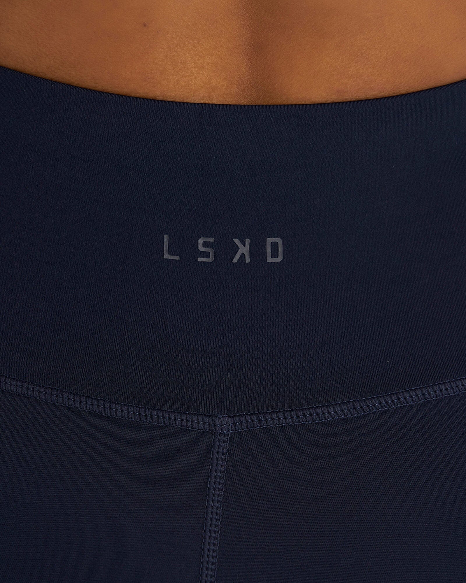 Model wearing Rep Mid Short Tight Small Logo - Navy