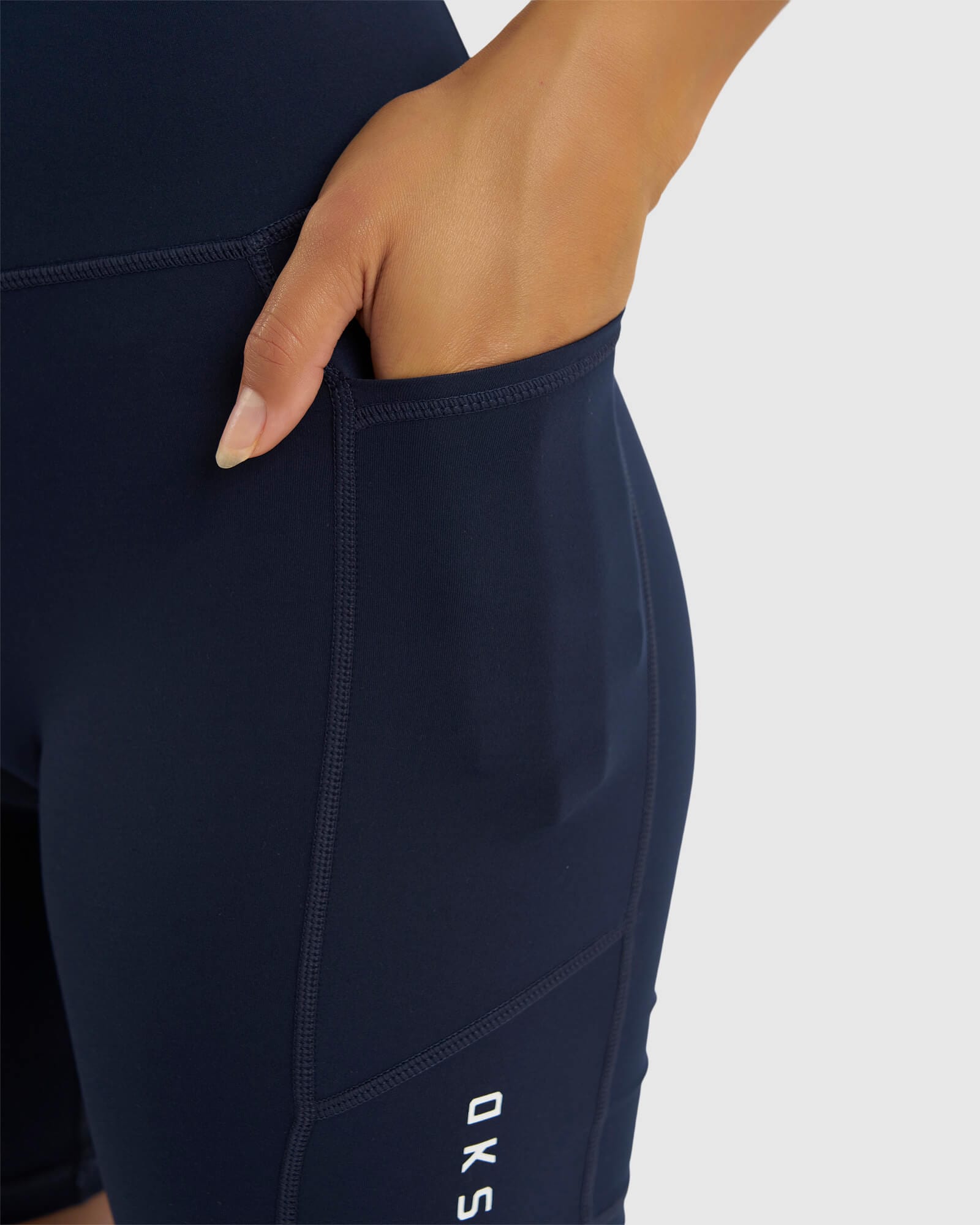 Model wearing Rep Mid Short Tight Small Logo - Navy