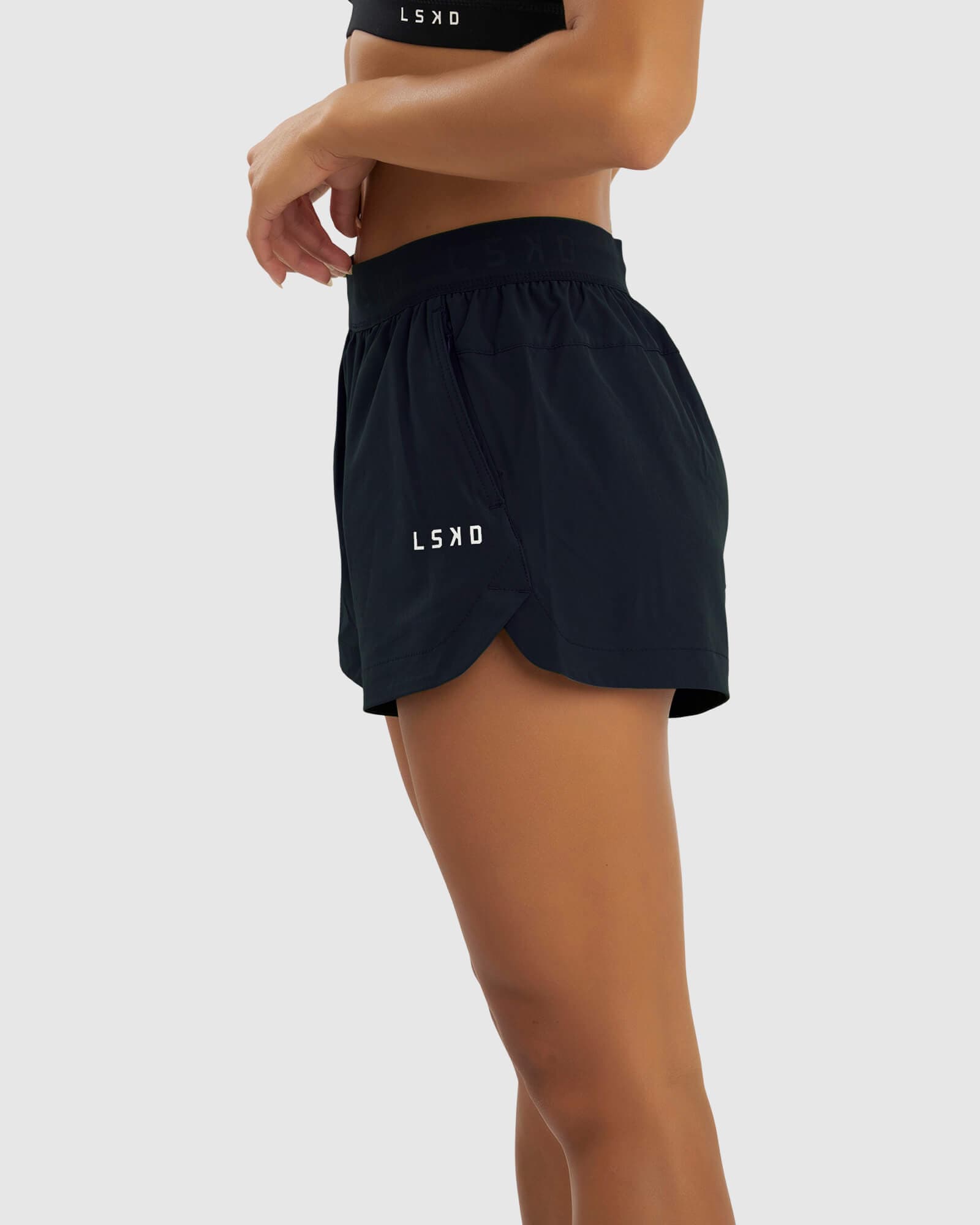 Model wearing Competition Performance Short - Carbon