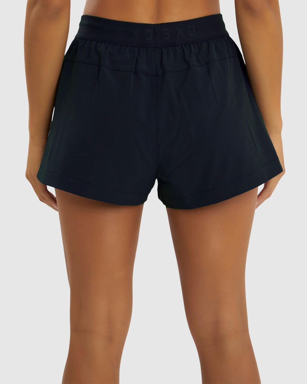 Model wearing Competition Performance Short - Carbon