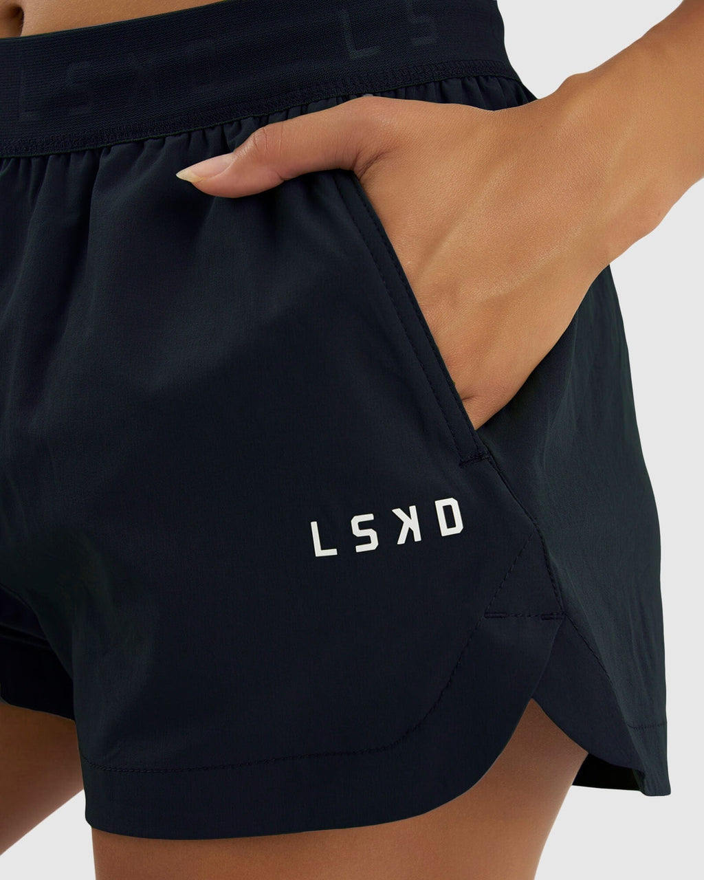 Model wearing Competition Performance Short - Carbon