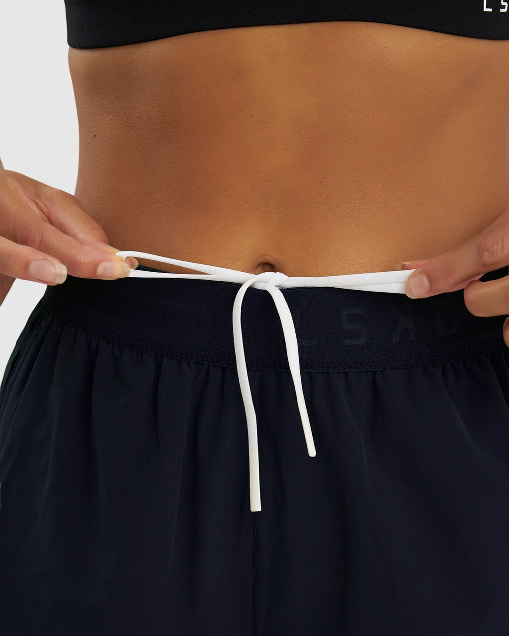 Model wearing Competition Performance Short - Carbon