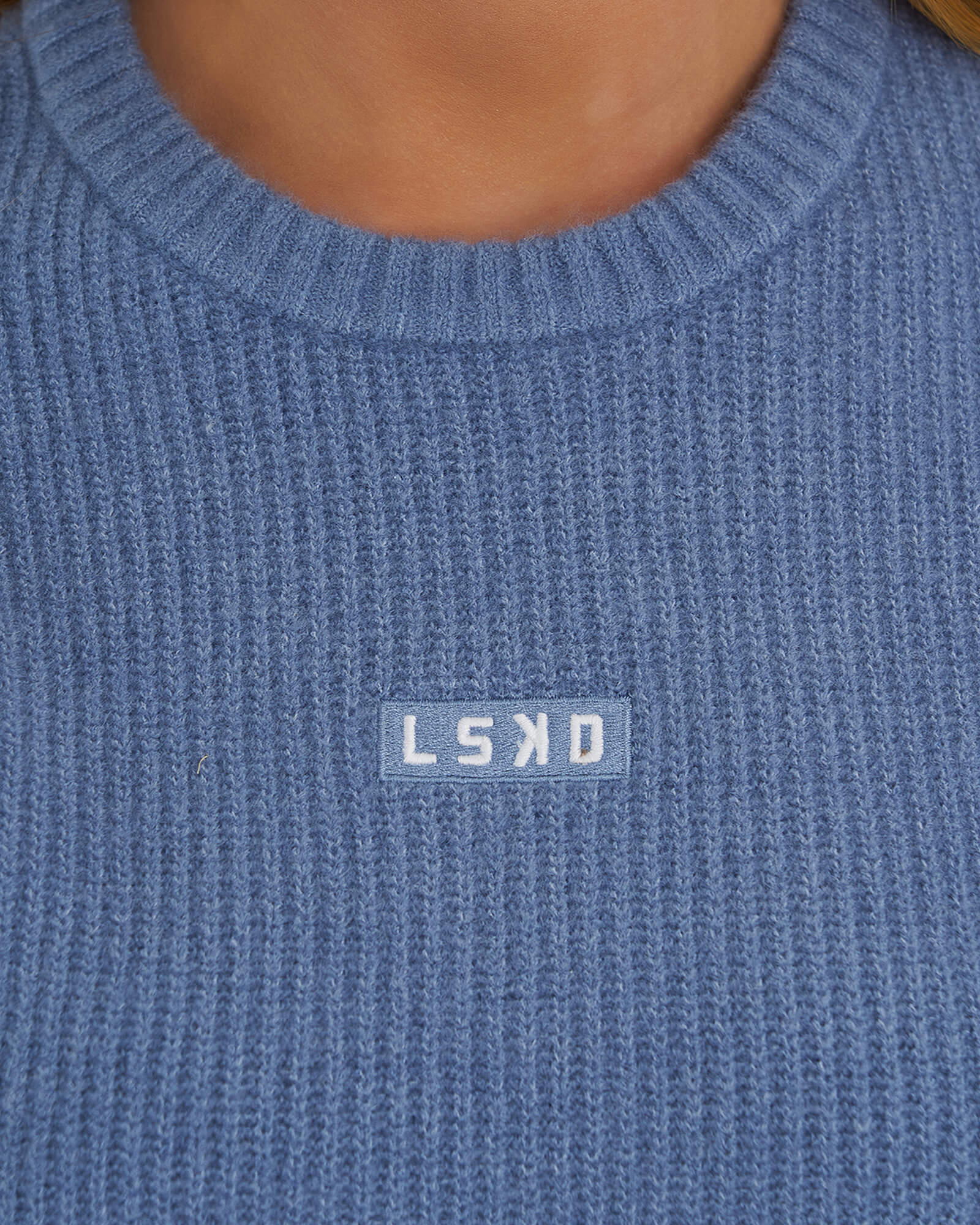 Model wearing Cornerstone Knit Sweater Dress - Dusty Blue