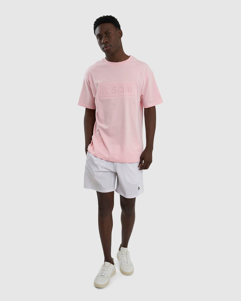 Model wearing Unisex Imprint Tee Oversize - Petal Pink