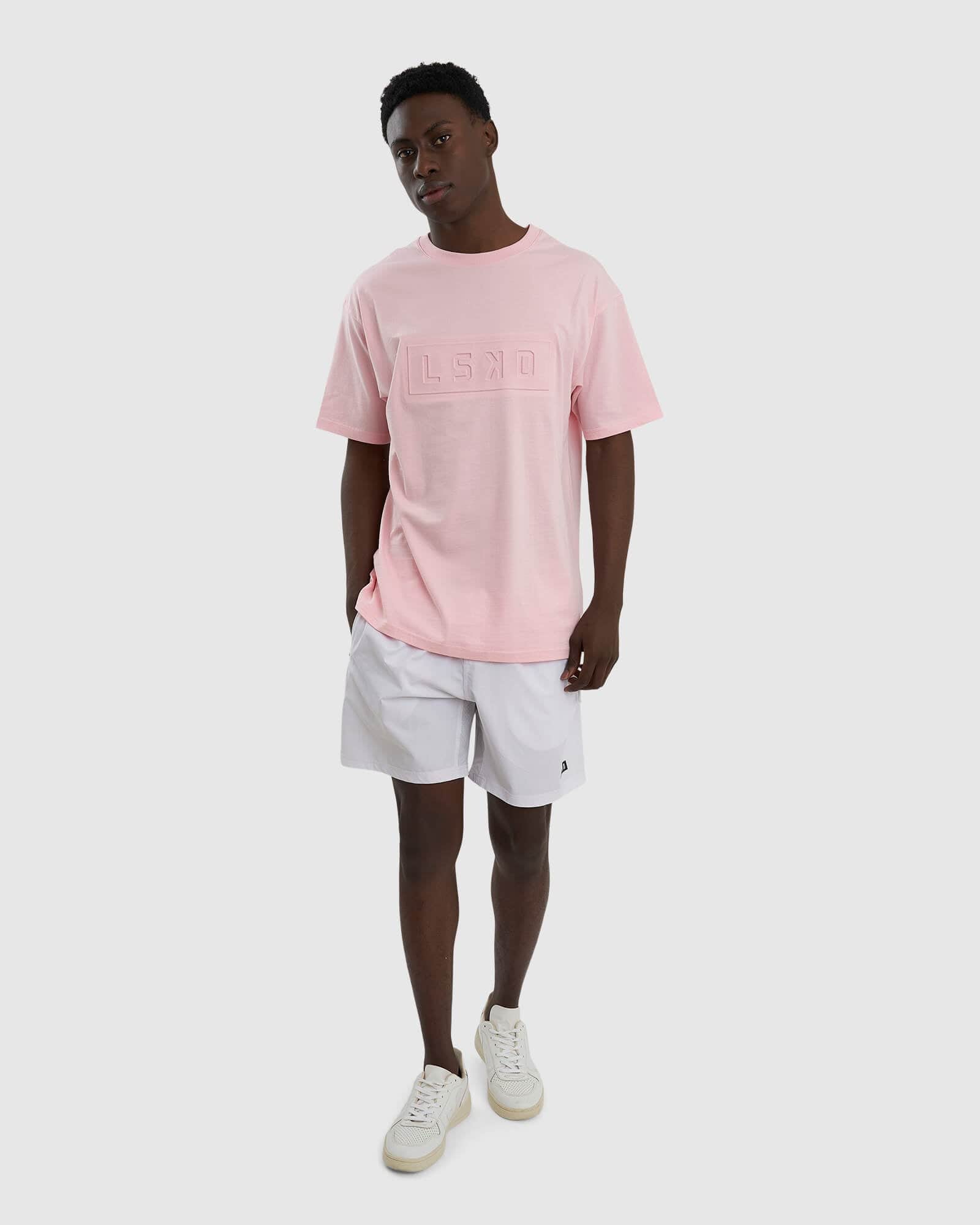 Model wearing Unisex Imprint Tee Oversize - Petal Pink