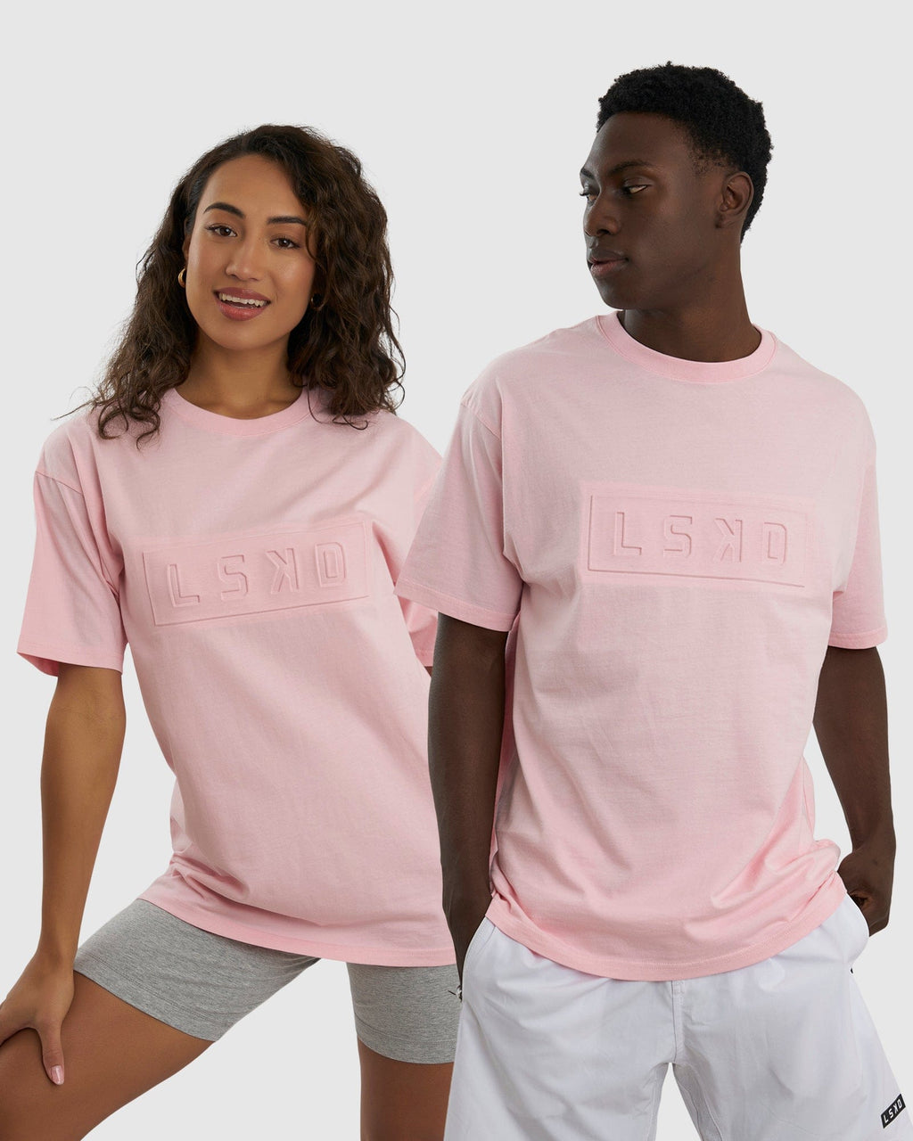 Model wearing Unisex Imprint Tee Oversize - Petal Pink