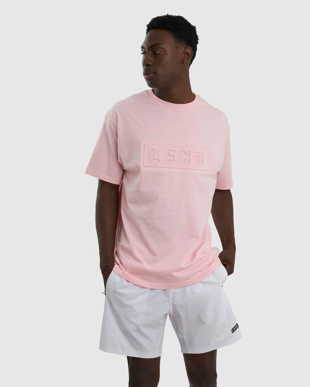 Model wearing Unisex Imprint Tee Oversize - Petal Pink