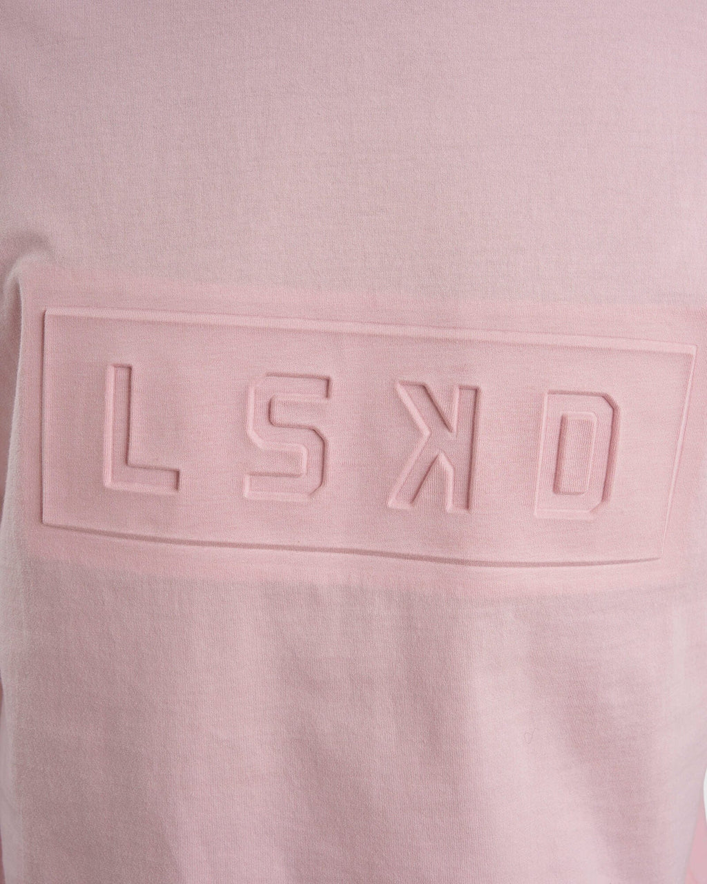 Model wearing Unisex Imprint Tee Oversize - Petal Pink