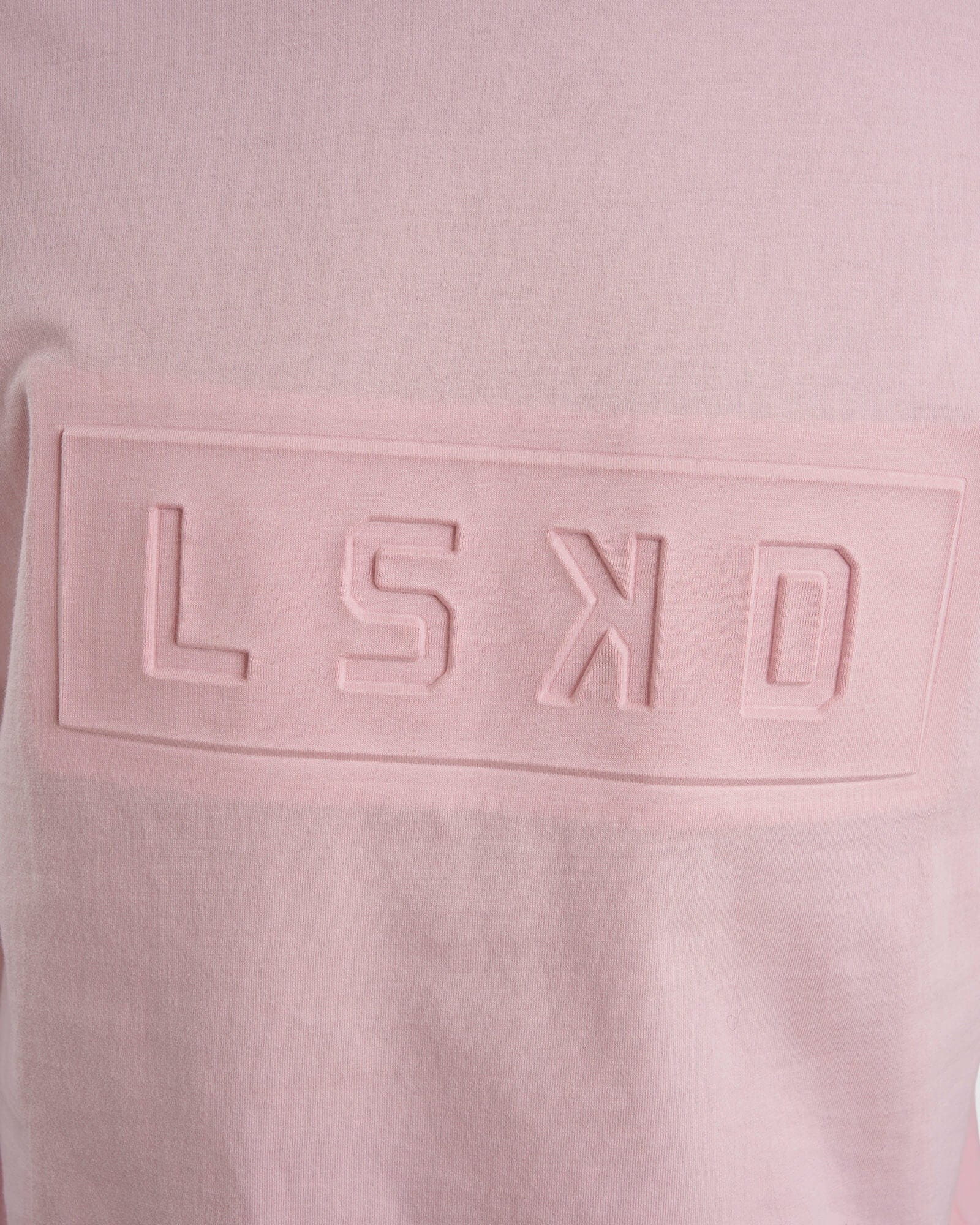 Model wearing Unisex Imprint Tee Oversize - Petal Pink