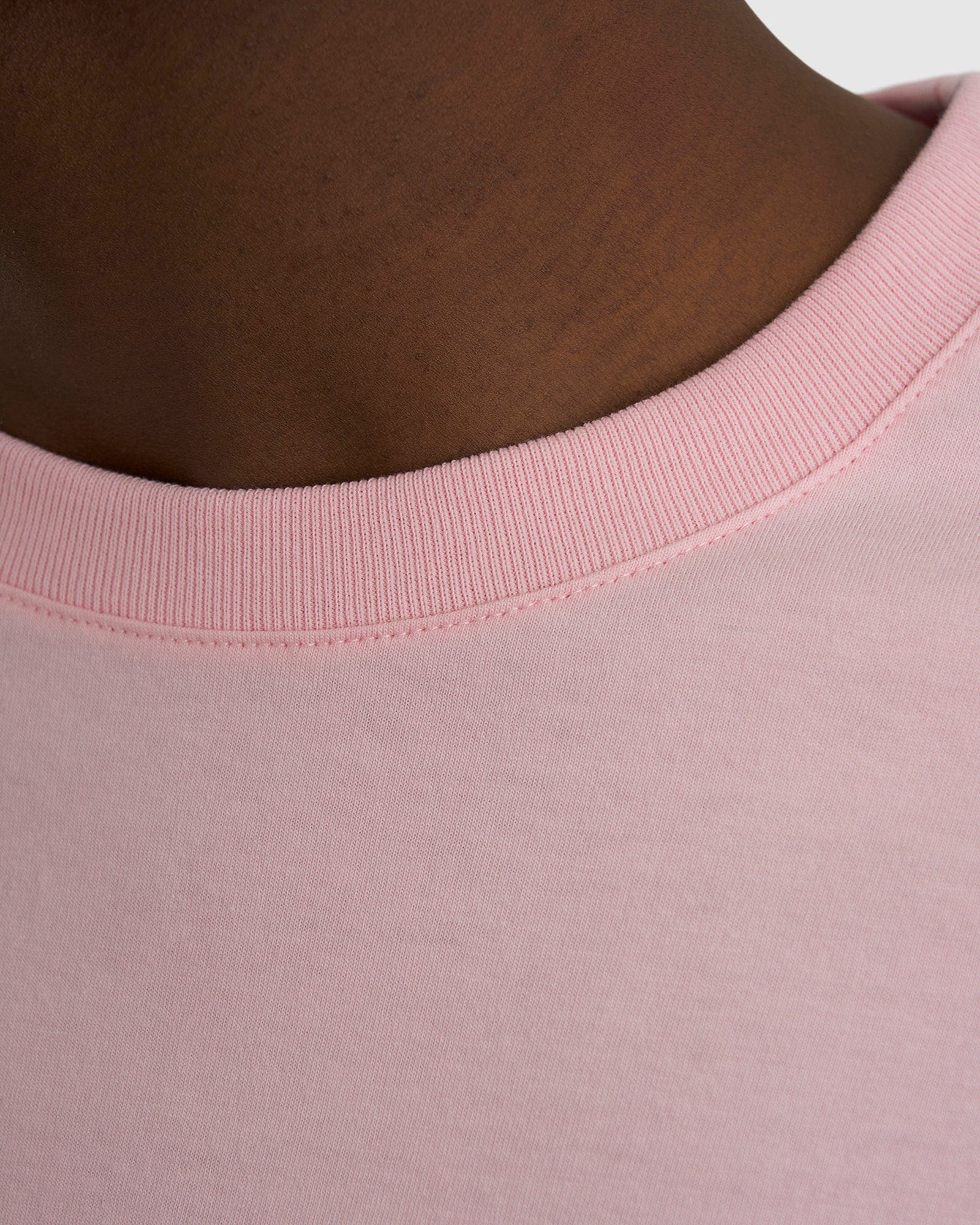 Model wearing Imprint Tee Oversize - Petal Pink