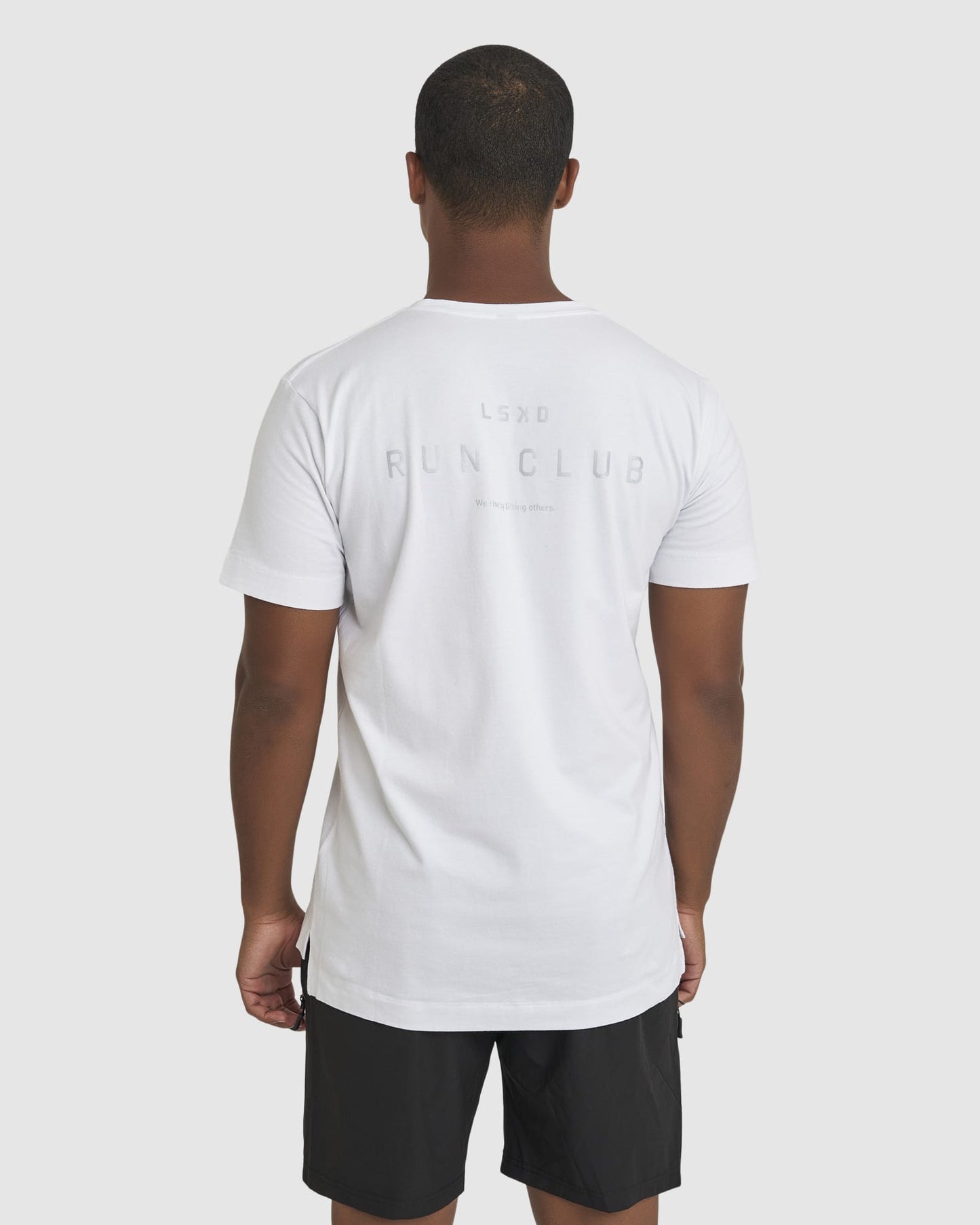 Model wearing Run Club FLXDRY Performance Tee - White-Reflective