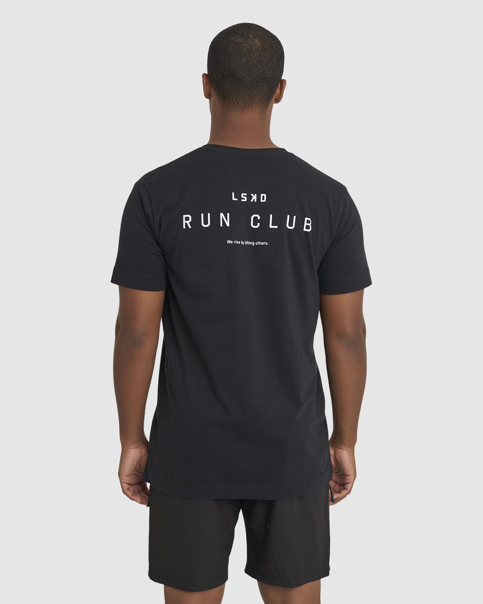 Model wearing Run Club FLXDRY Performance Tee - Black-Reflective