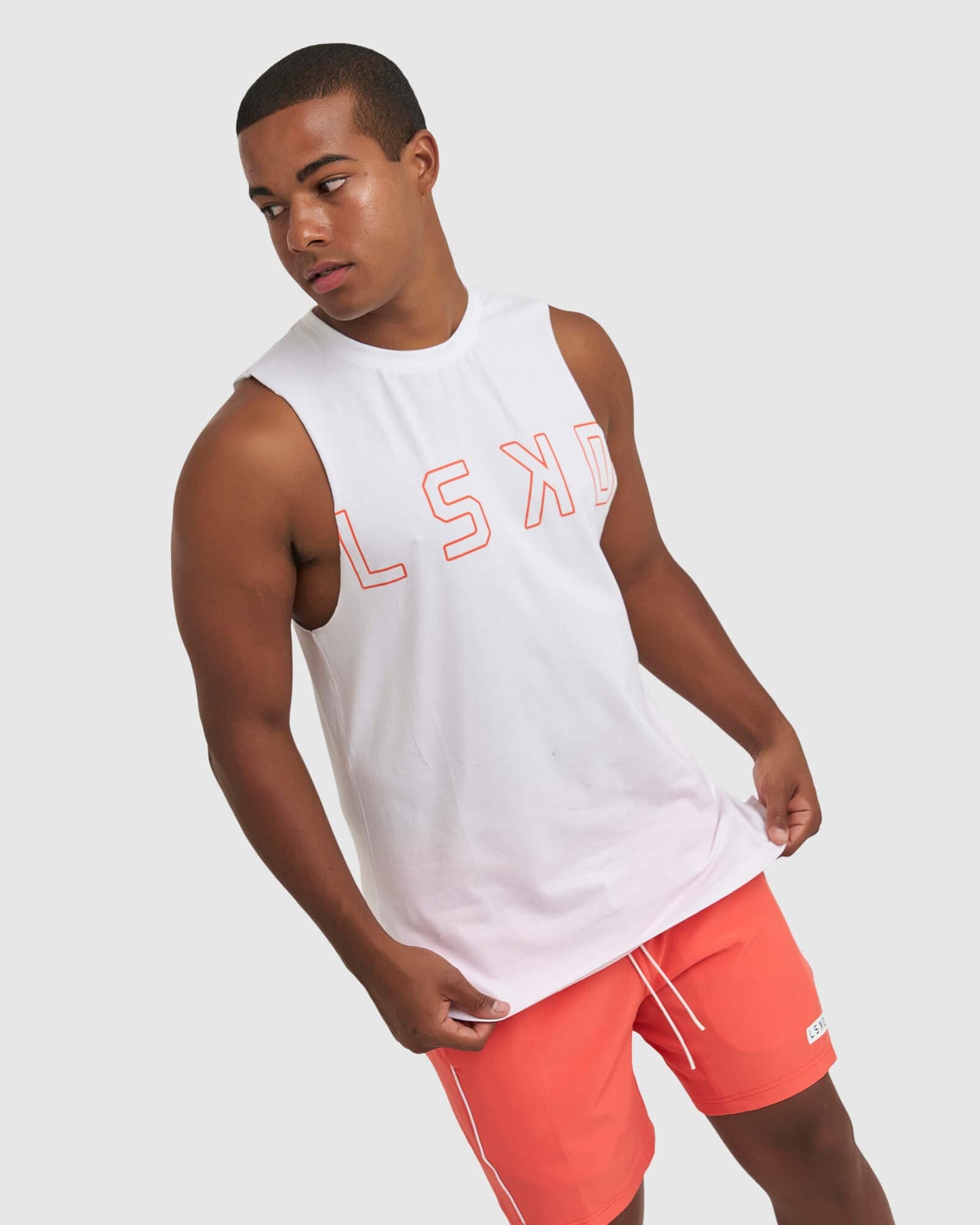 Model wearing Expand FLXCotton Training Fit Tank - White-Fruit Punch