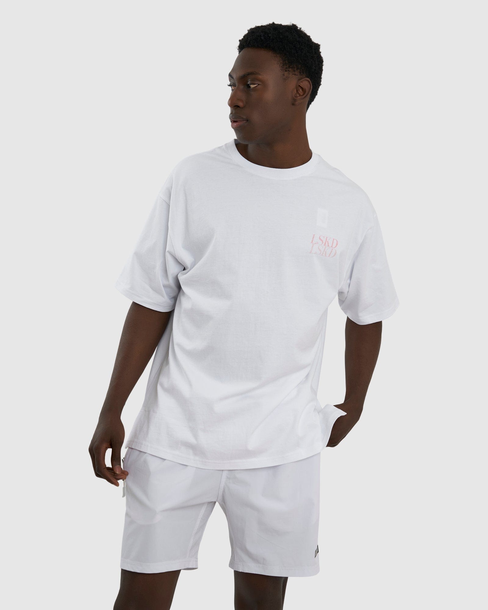 Model wearing Aurora Tee Oversized - White