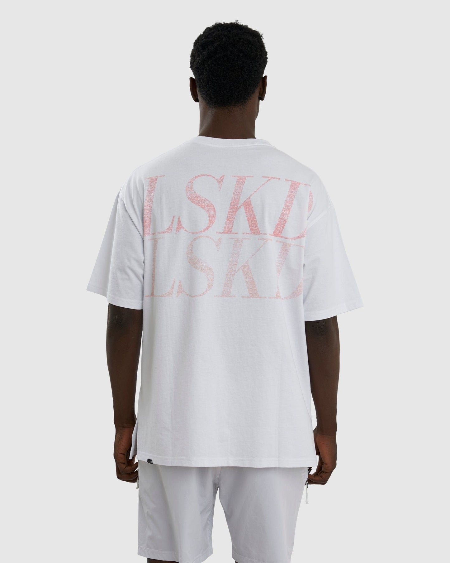 Model wearing Aurora Tee Oversized - White