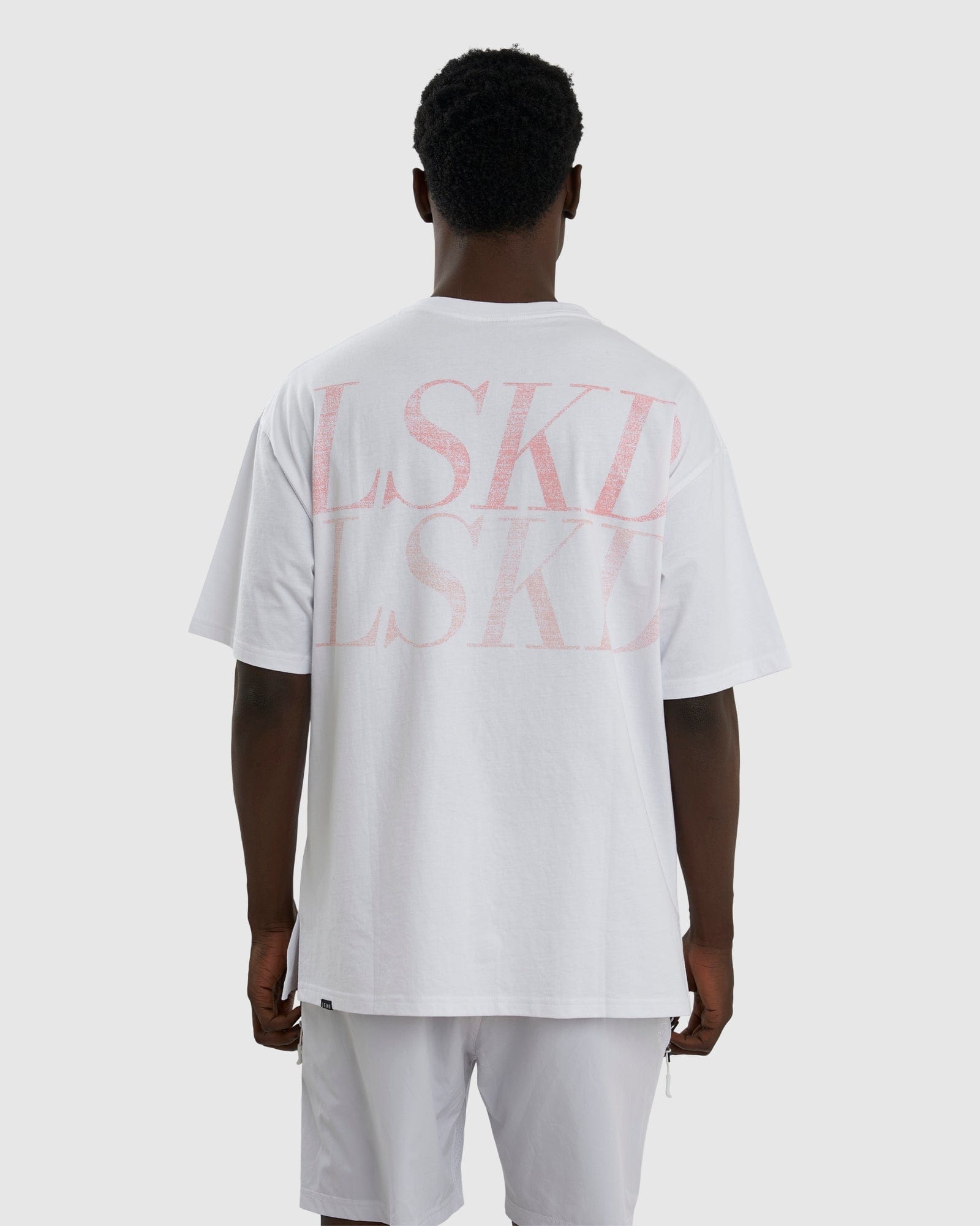 Model wearing Aurora Tee Oversized - White