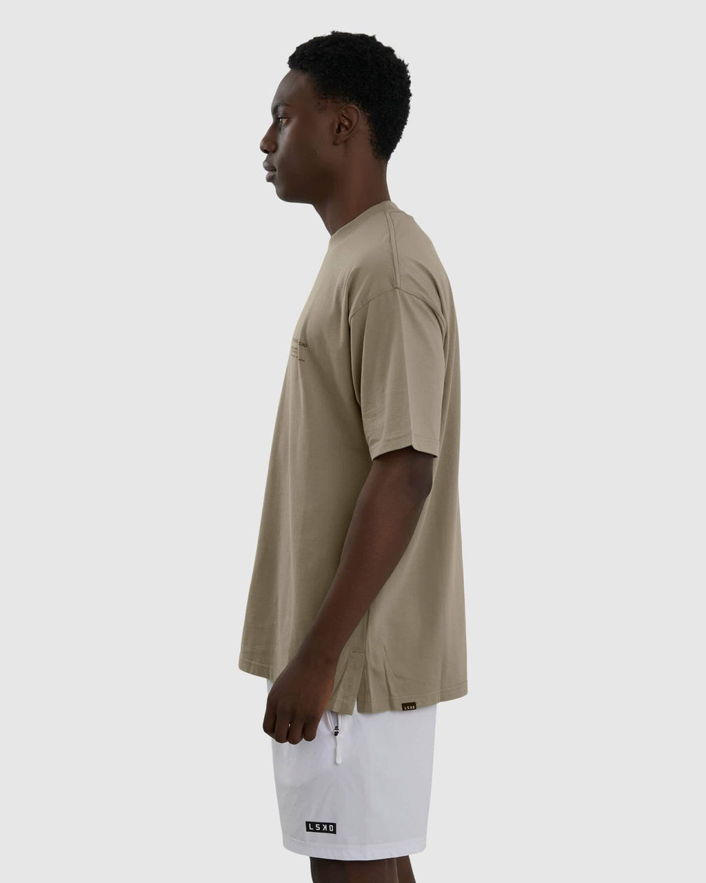 Model wearing Unisex Official Tee Oversize - Laurel Oak