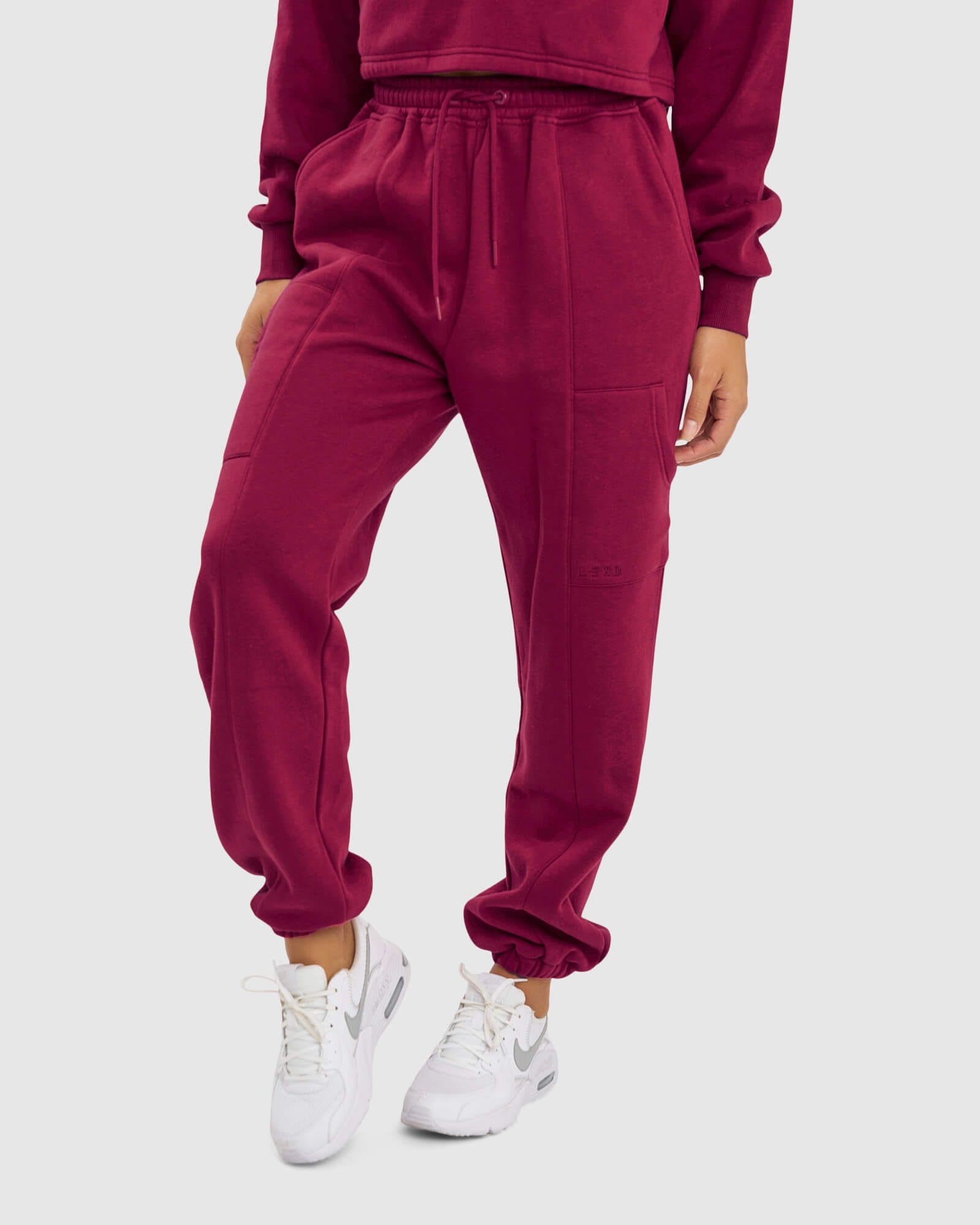 Model wearing Harley Track Pant - Candy Apple