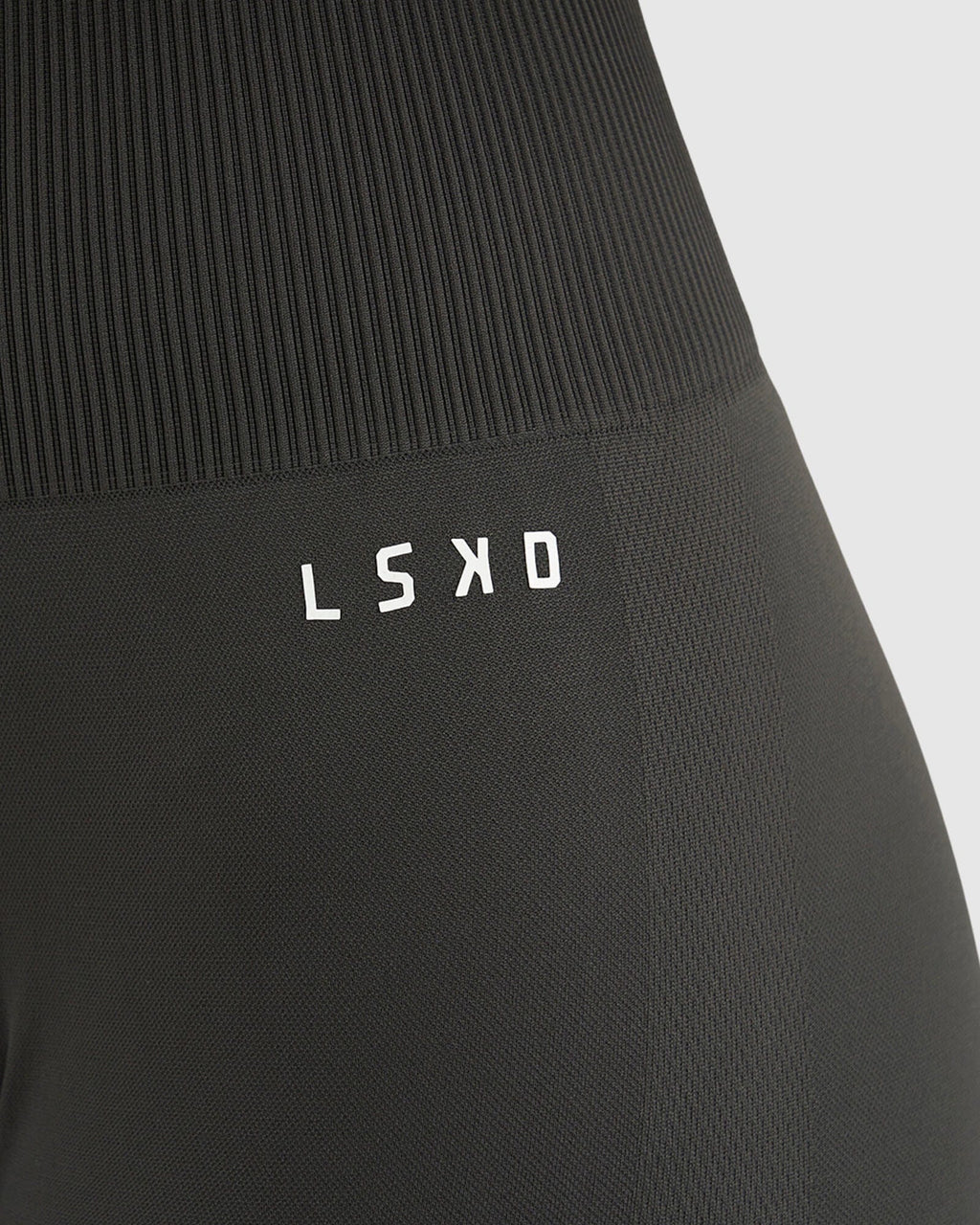 Model wearing Limitless Seamless 7/8 Length Tights - Charcoal