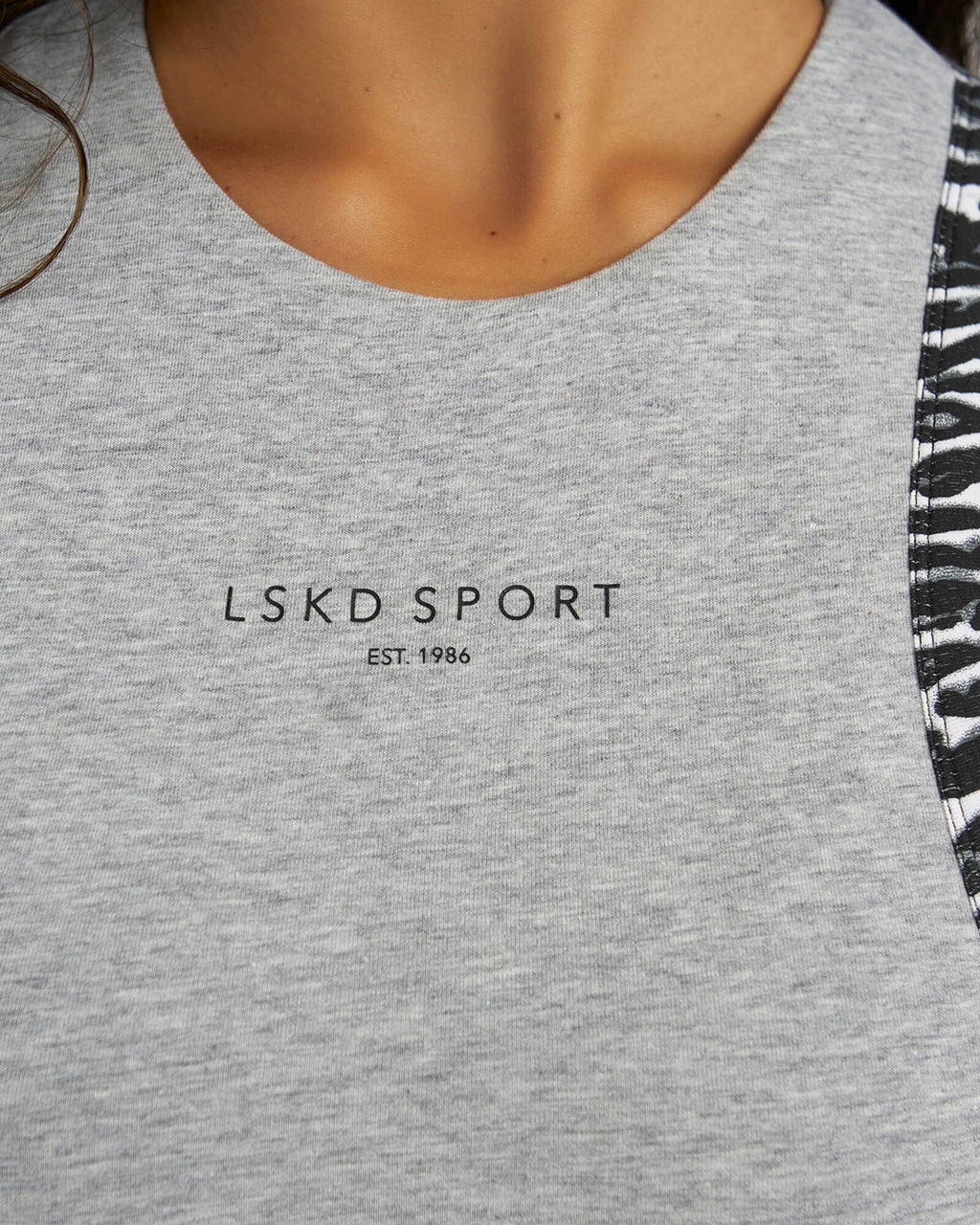 Model wearing Run Tank - Lt Grey Marl