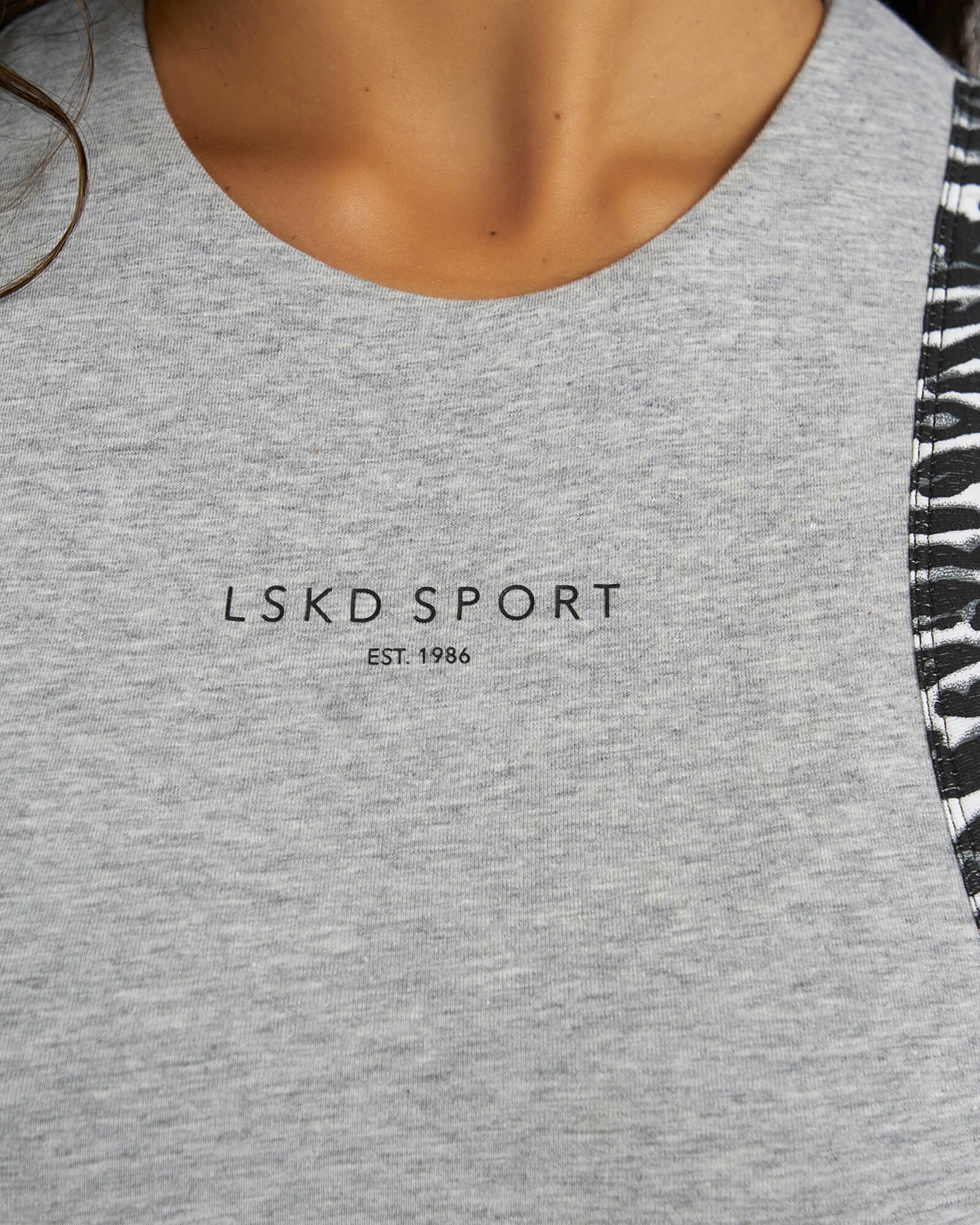 Model wearing Run Tank - Lt Grey Marl