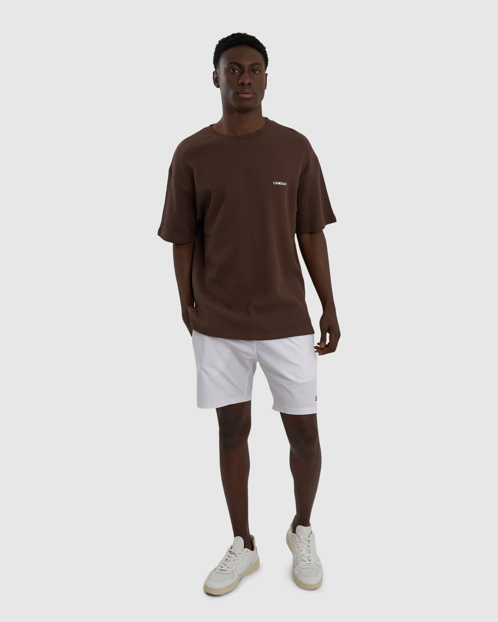 Model wearing Unisex Verse Waffle Tee - Walnut