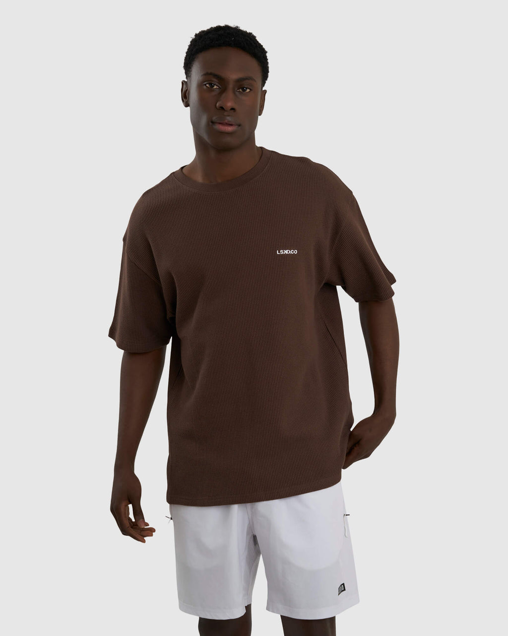 Model wearing Unisex Verse Waffle Tee - Walnut